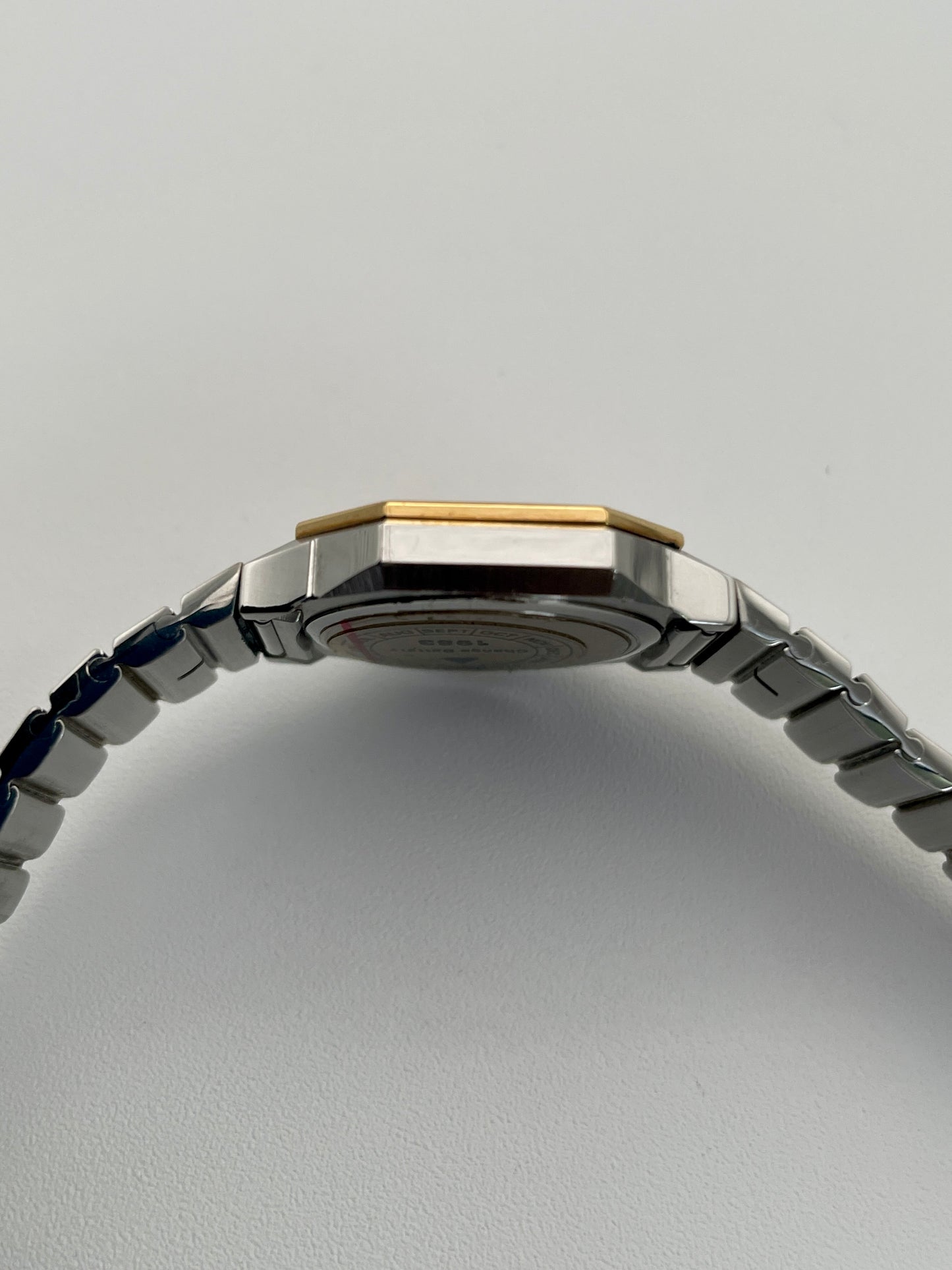 Side view of the 1980s Longines Octagon "Royal Oak" ladies quartz watch, showcasing the thin profile, gold-tone crown, and bezel screws.