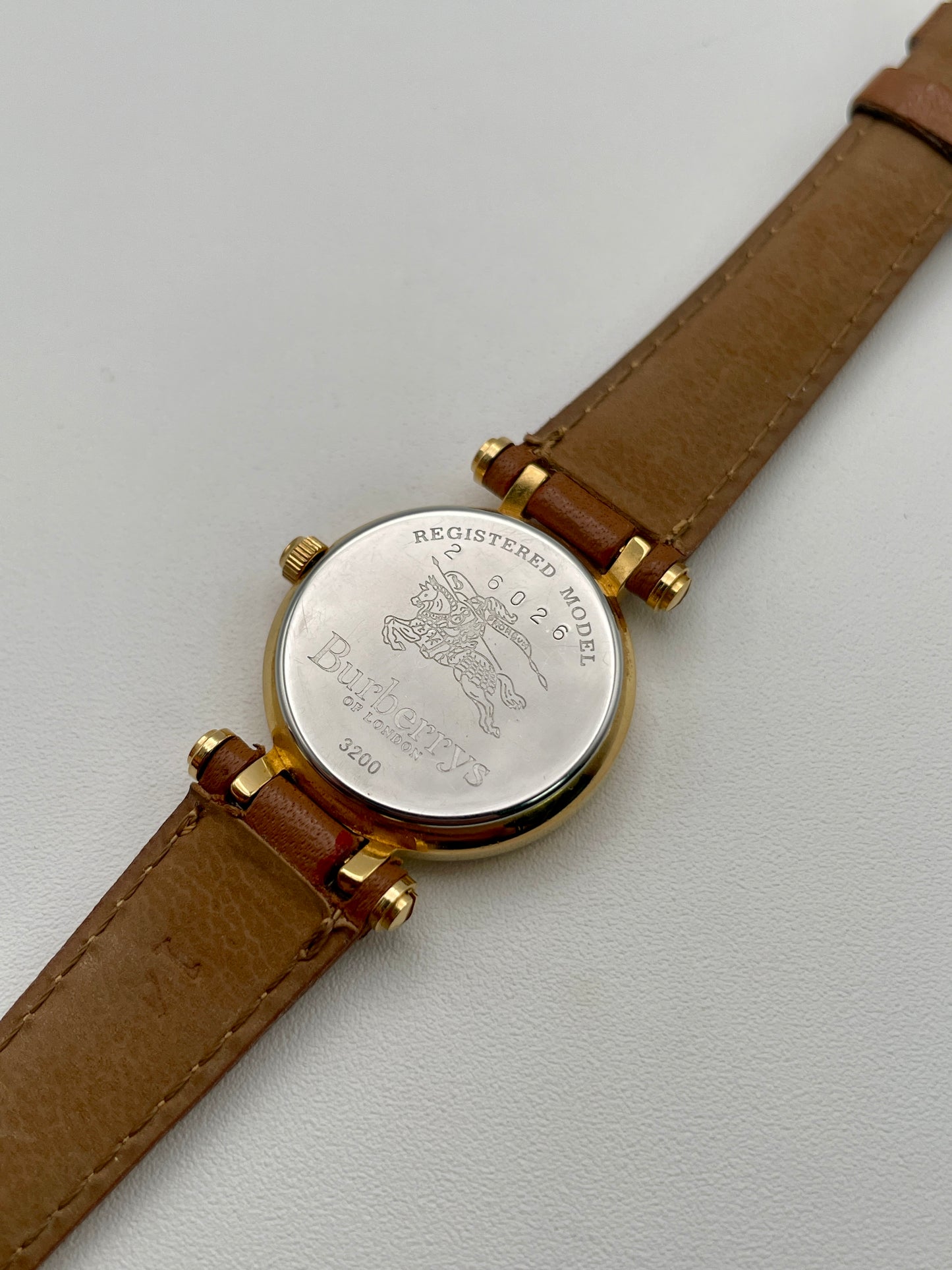 Caseback of Burberry 3200 showing engraved knight emblem and model number