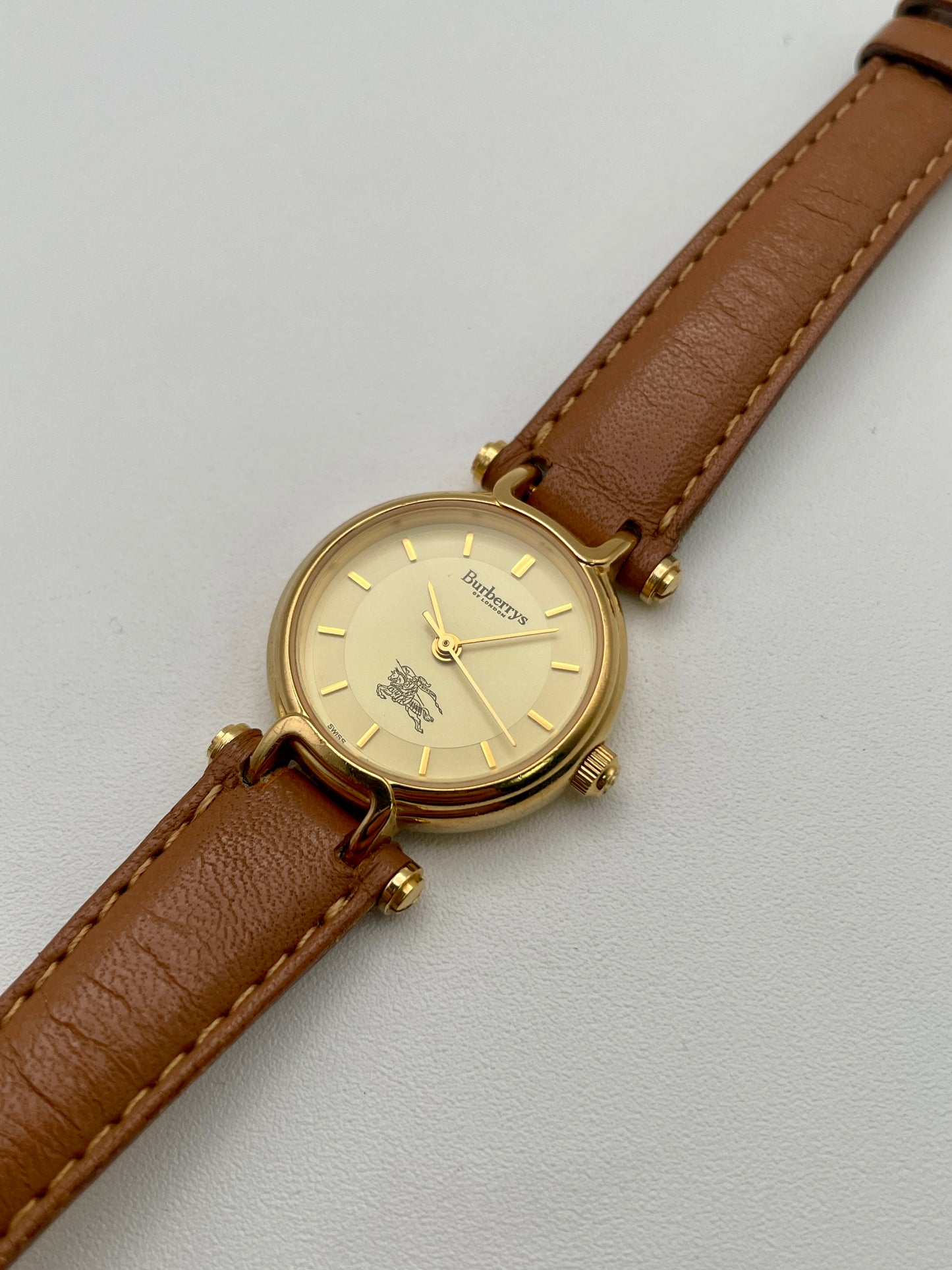 Diagonal view of Burberry 3200 vintage watch with stitched leather strap