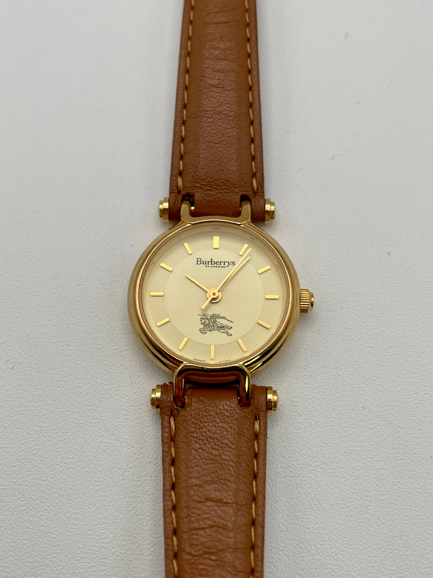 Front close-up of Burberry 3200 watch showing gold-tone dial and logo detailing