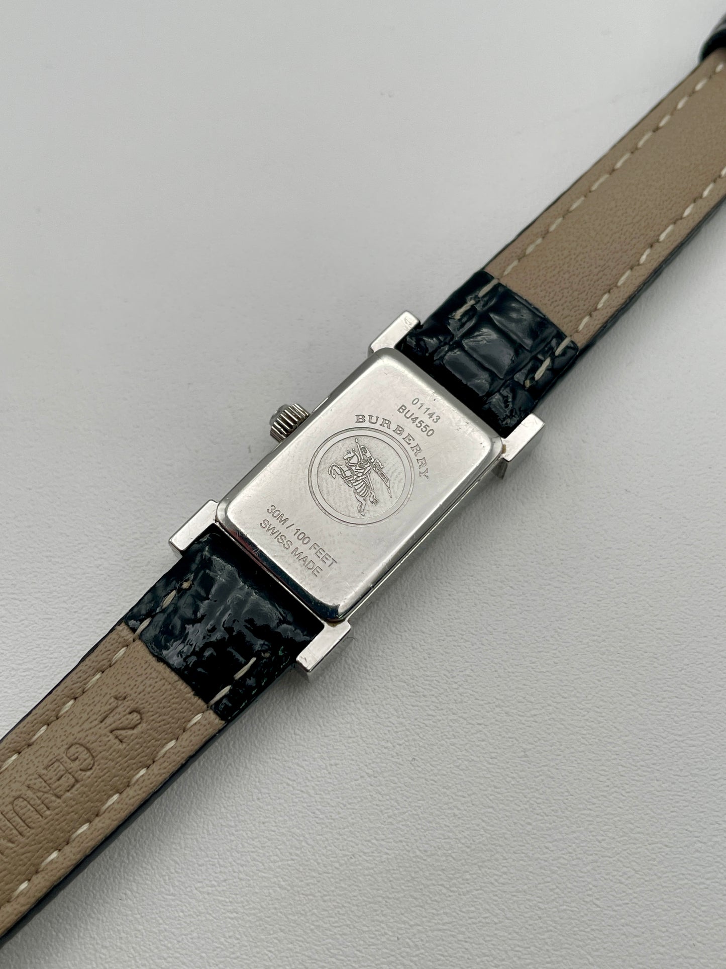 Caseback of Burberry vintage watch showing engraved logo and water resistance details