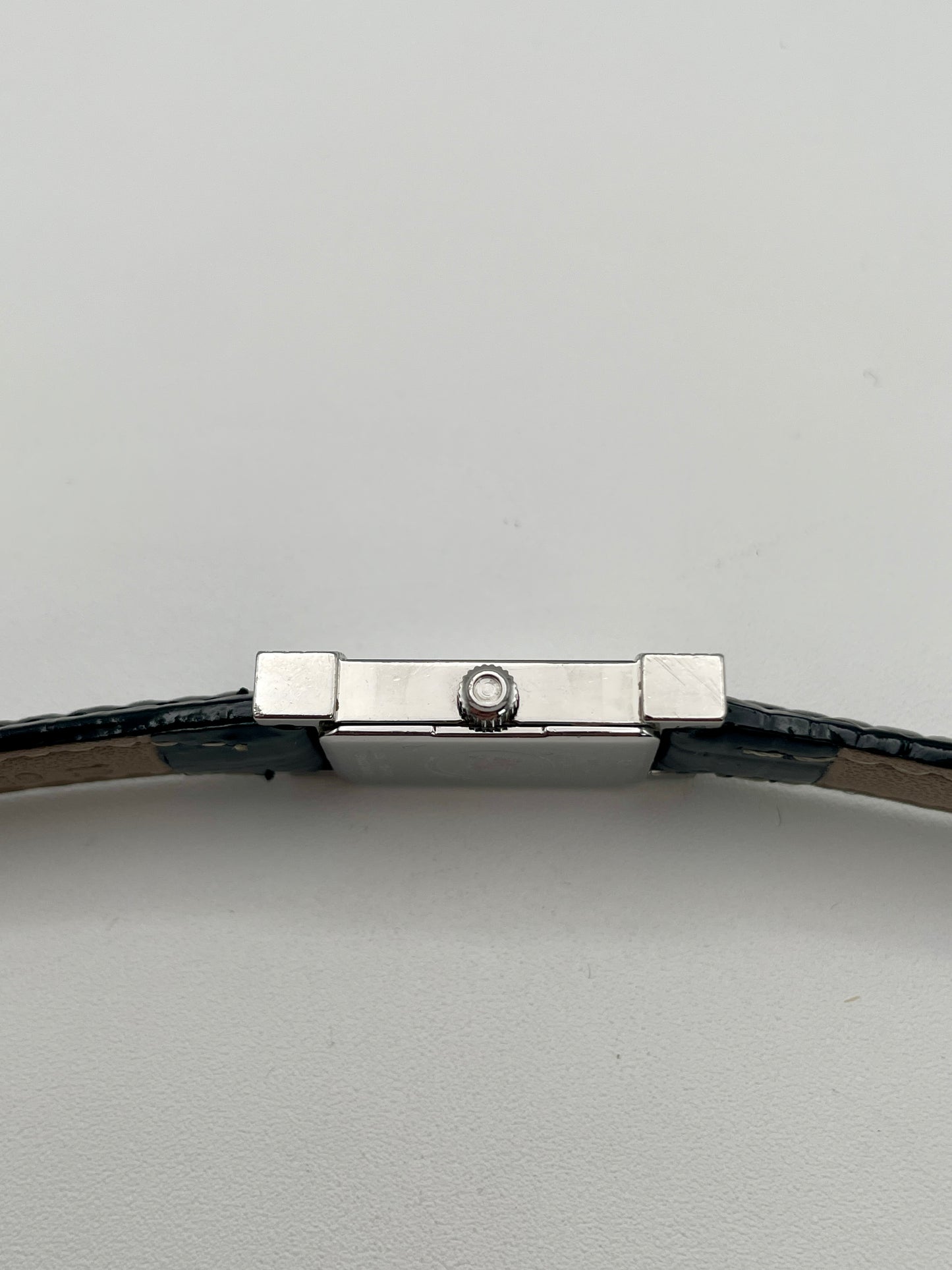 Side view showing the crown with cabochon detail on the Burberry steel watch