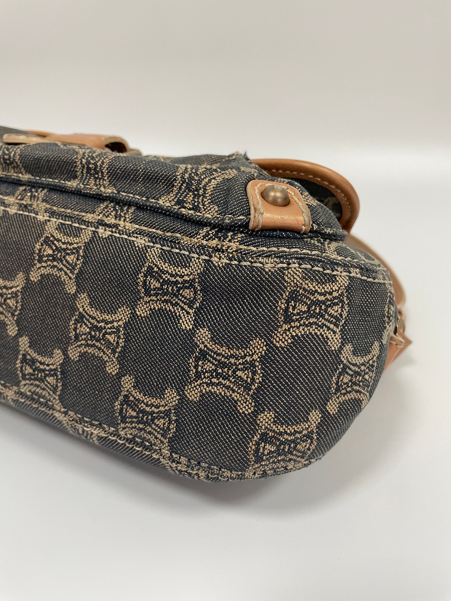 Bottom corner view of the Celine Macadam Shoulder Bag in denim, highlighting the signature Celine Macadam pattern.