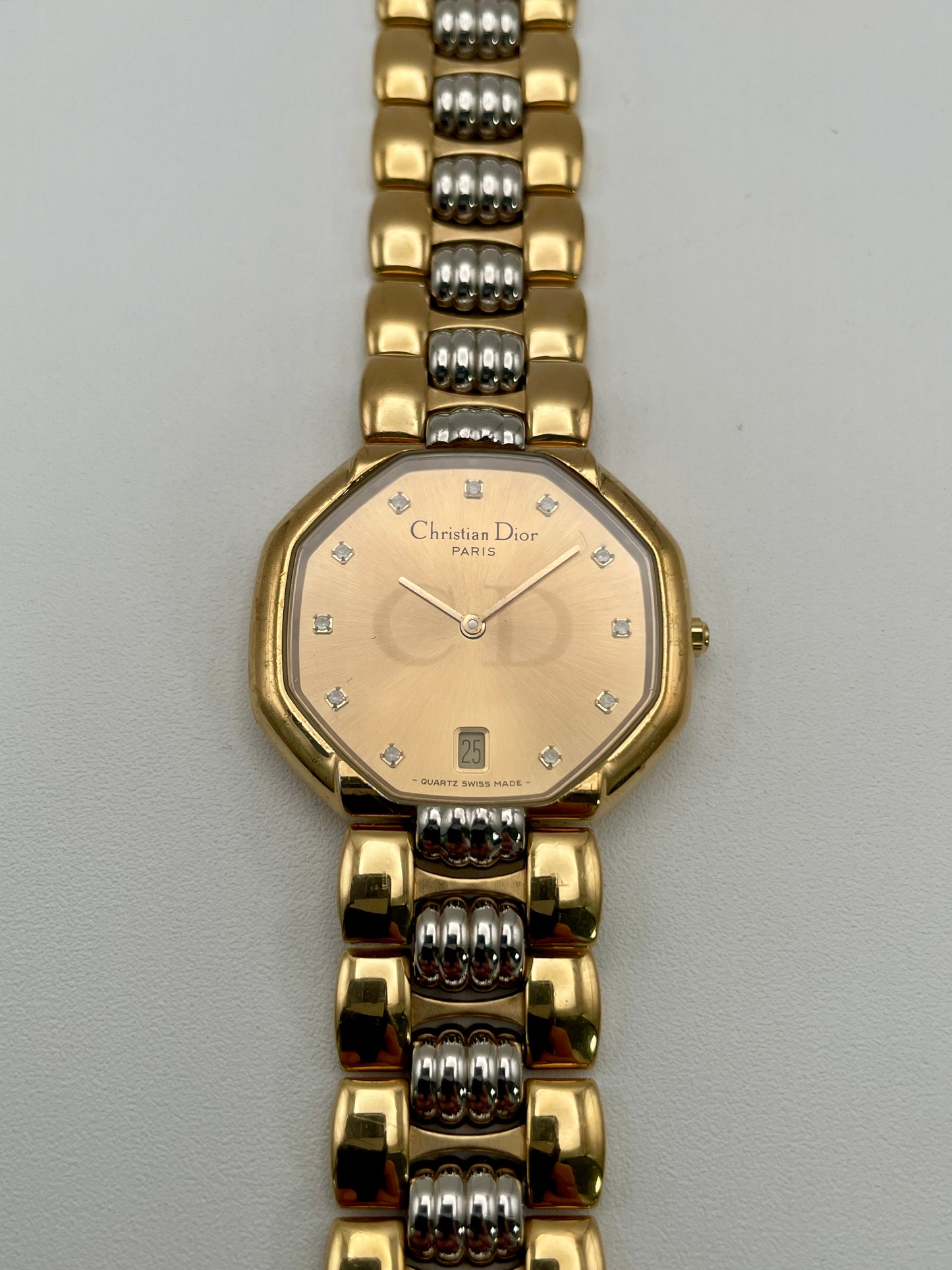 Christian Dior Déposé Octagon Vintage Women's Watch in two-tone gold and steel, front view highlighting the champagne dial with crystal markers.