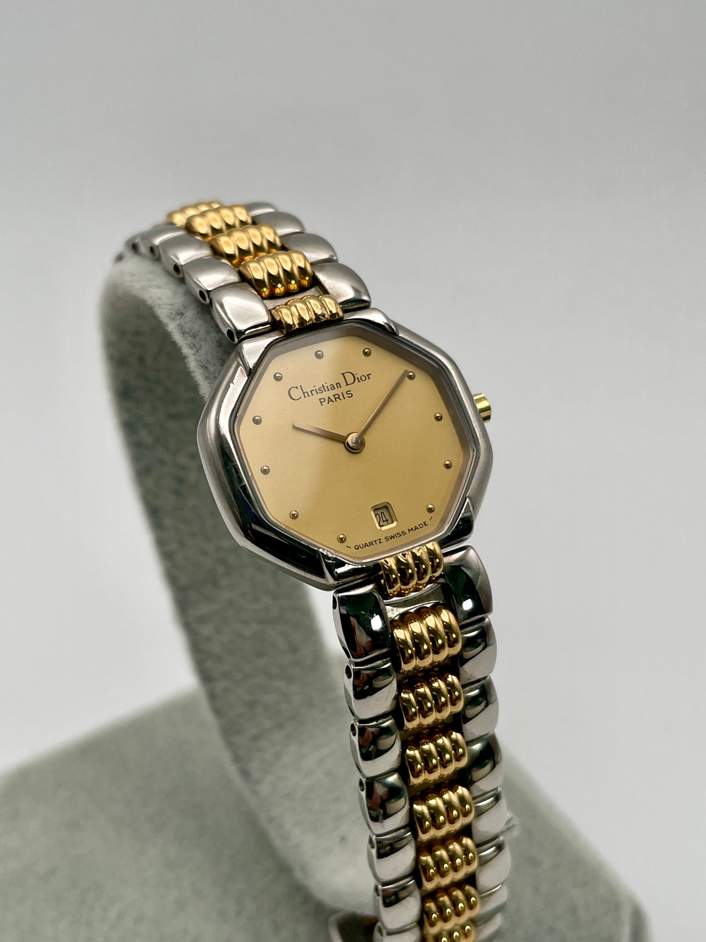 Christian Dior Déposé Octagon Vintage Women's Watch displayed at an angle, emphasizing its octagonal case and luxurious two-tone bracelet.