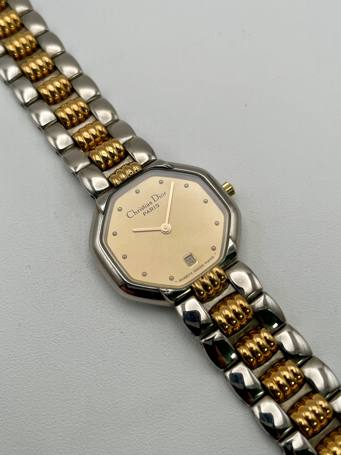 Christian Dior Déposé Octagon Vintage Women's Watch in two-tone steel and gold, front view showcasing the champagne dial and gold hour markers.