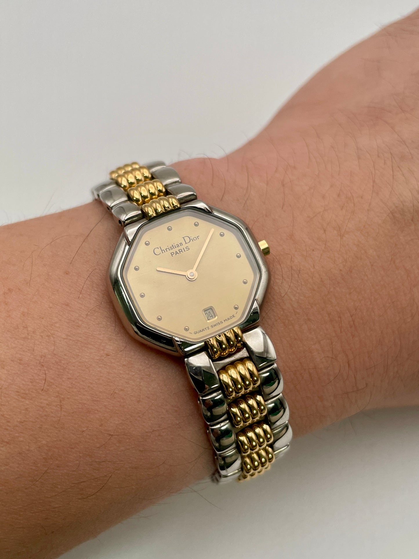 Christian Dior Déposé Octagon Vintage Women's Watch worn on the wrist, showcasing its elegant fit and two-tone bracelet.