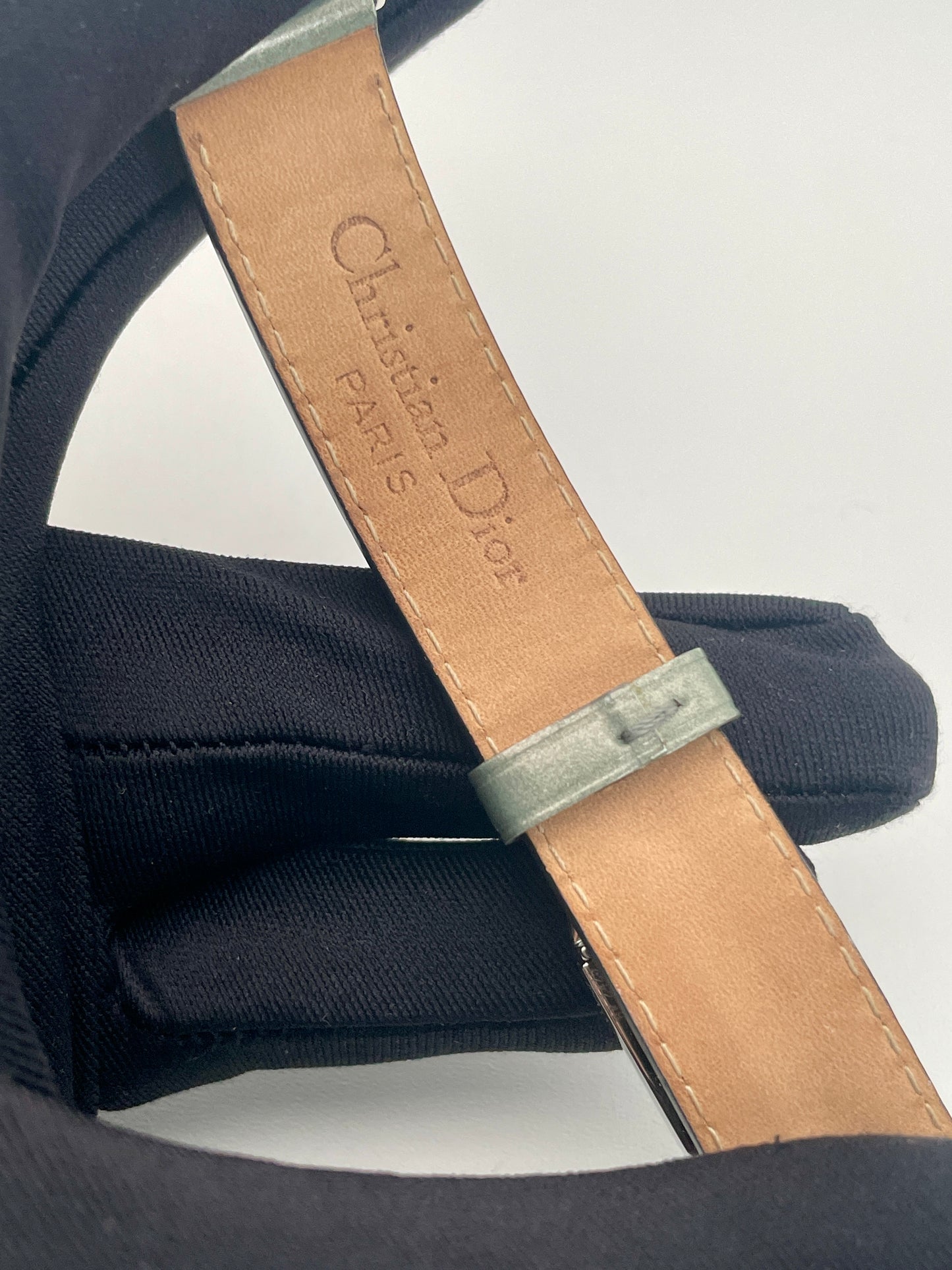 Inside view of the Christian Dior Pandiora watch’s green leather strap with Christian Dior Paris engraving.