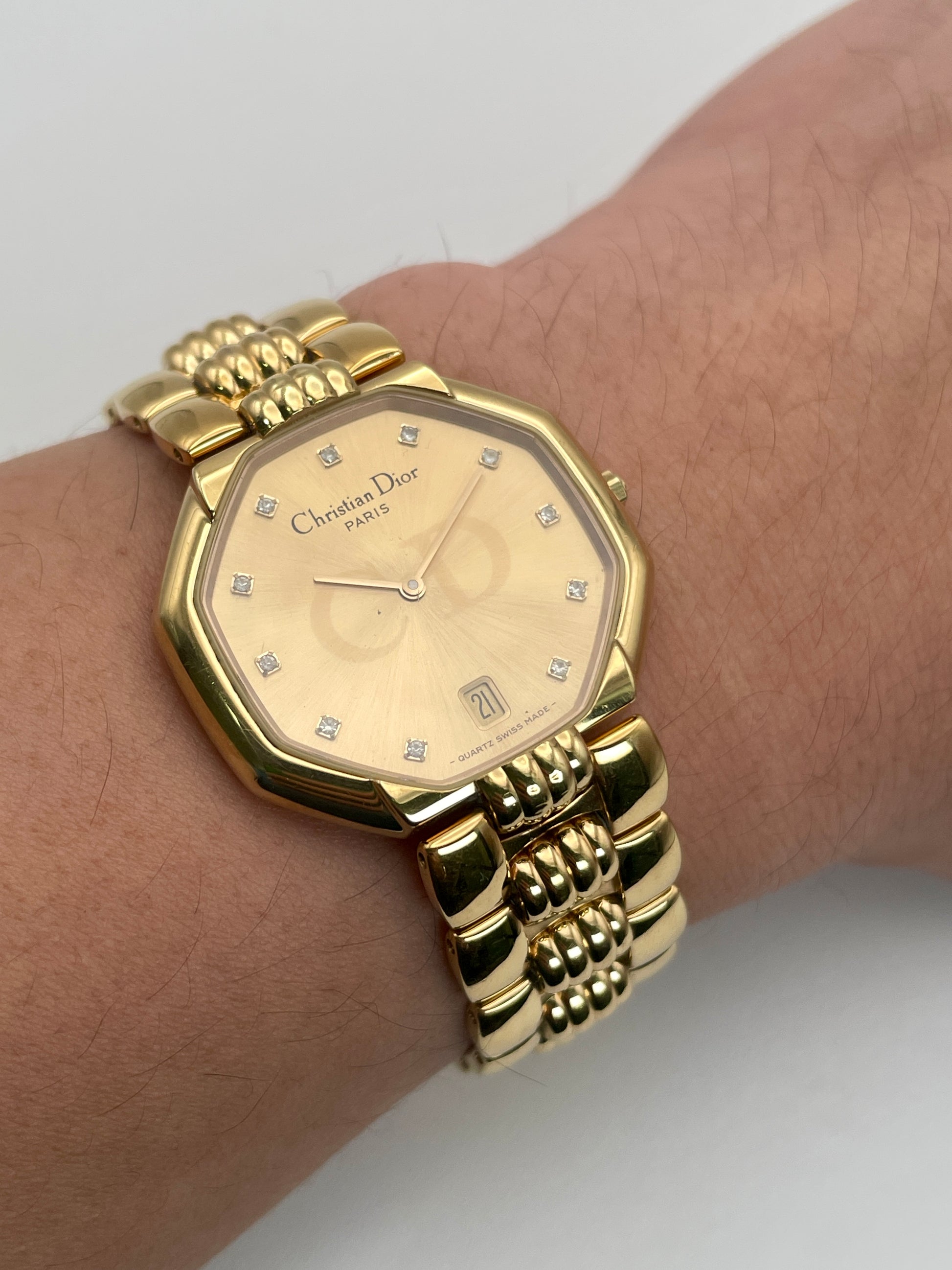 Christian Dior Depose Vintage Women's Watch in gold, displayed on wrist, showcasing the octagonal dial and textured link bracelet.