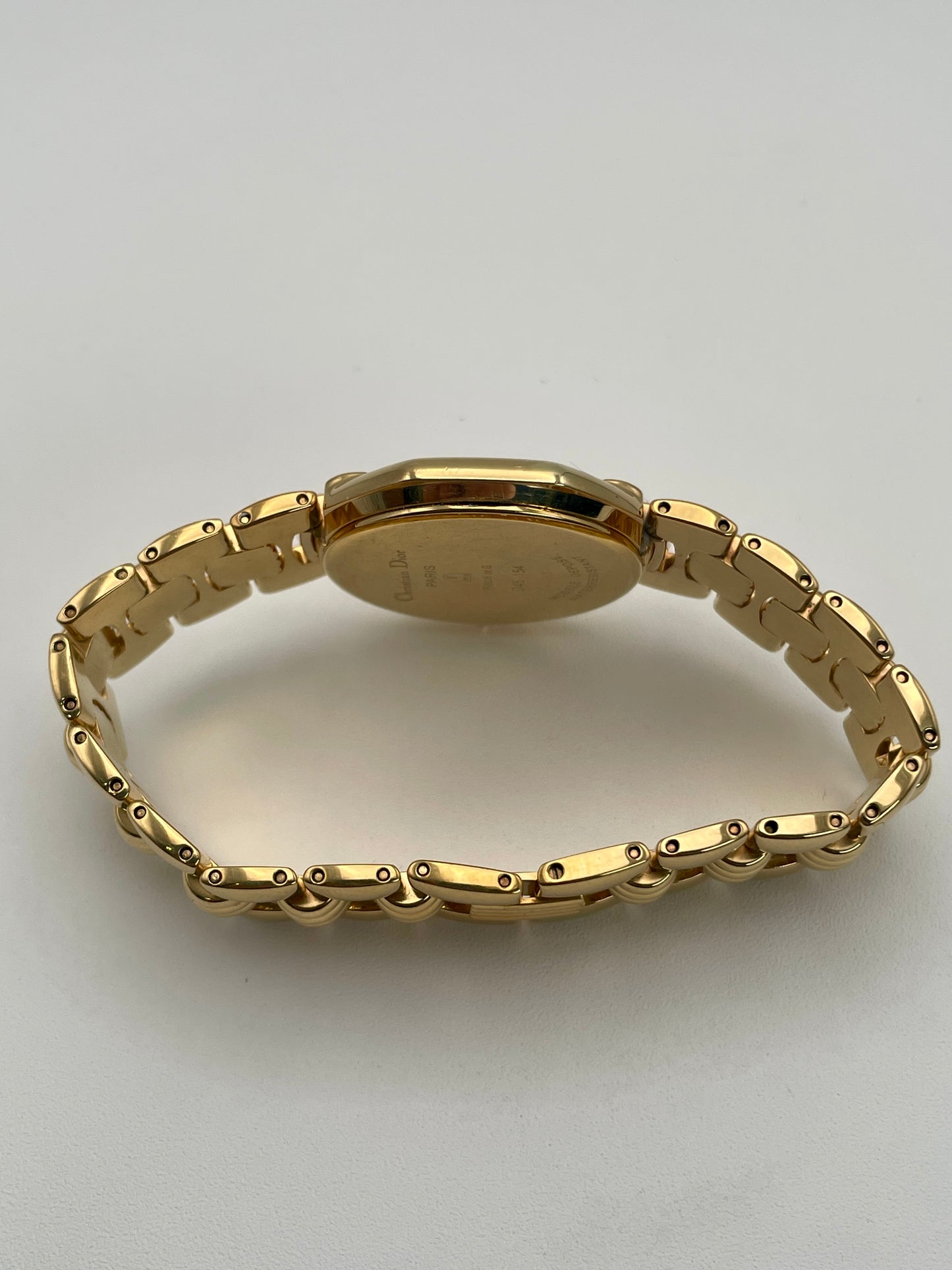 Side view of the Christian Dior Depose Vintage Women's Watch in gold, showcasing the slim profile and gold bracelet.