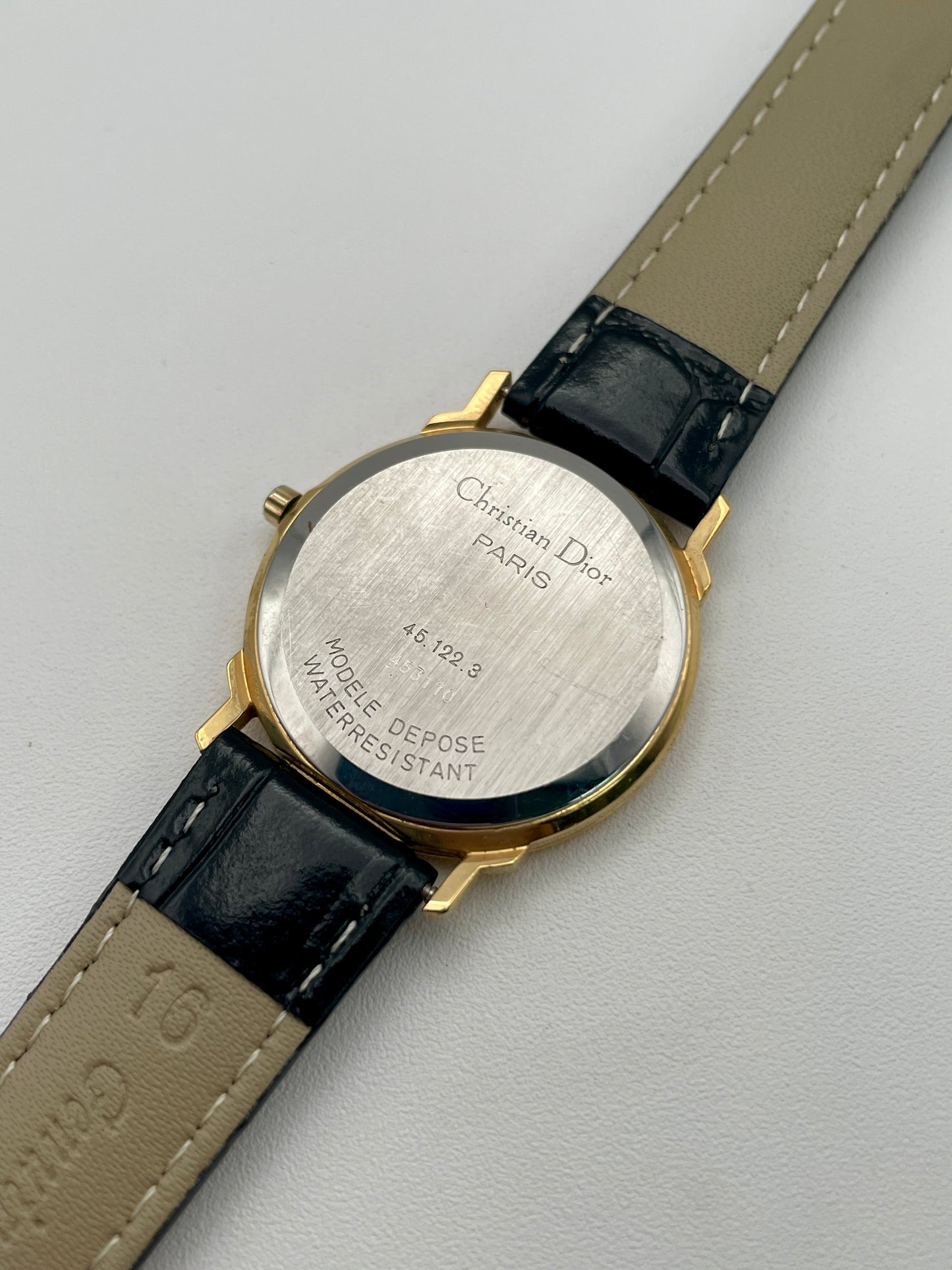 Stainless steel caseback of Christian Dior 45.122 with model number and water resistance engraving