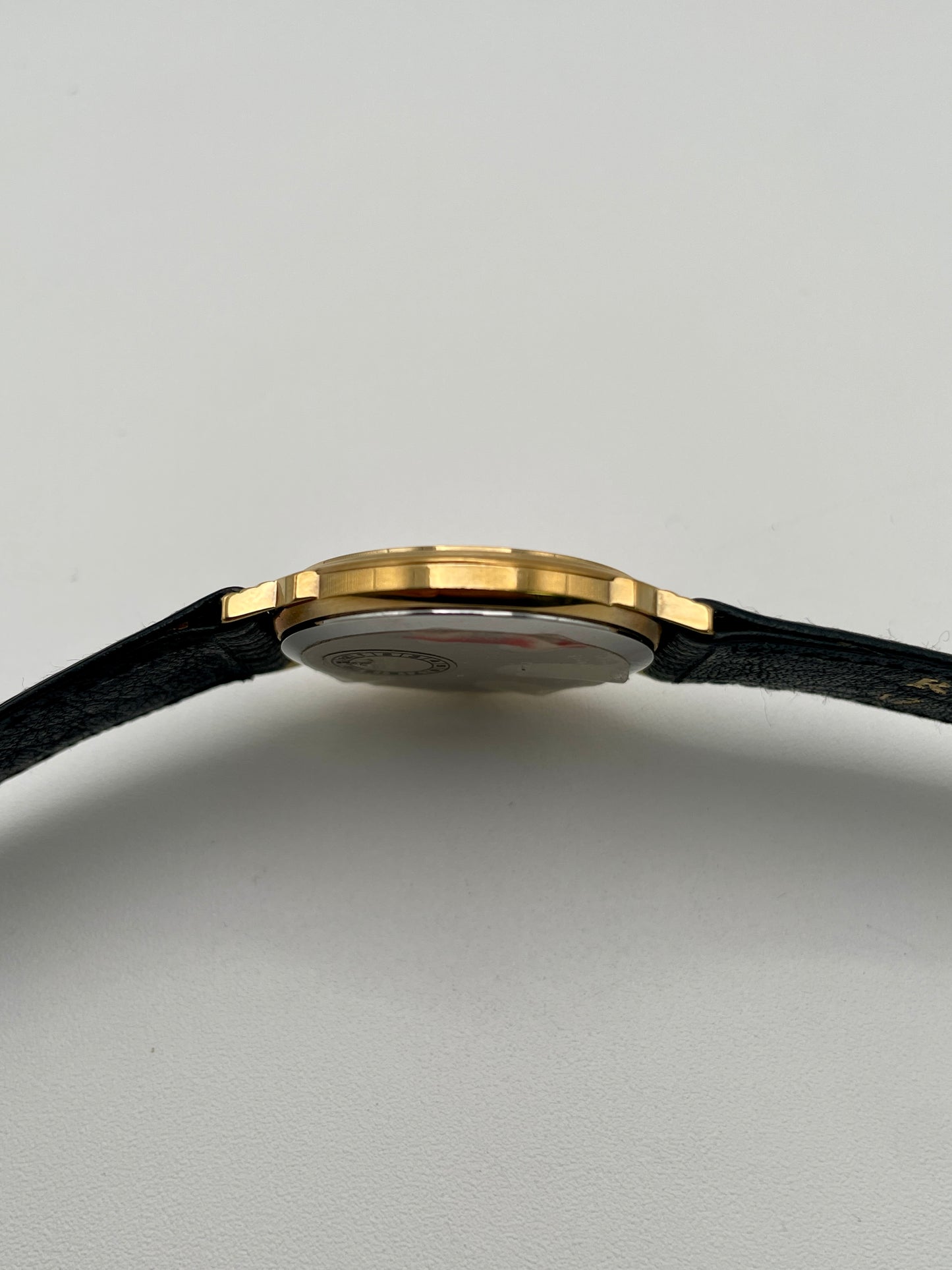Left side profile of Christian Dior 45.122 vintage watch in gold case