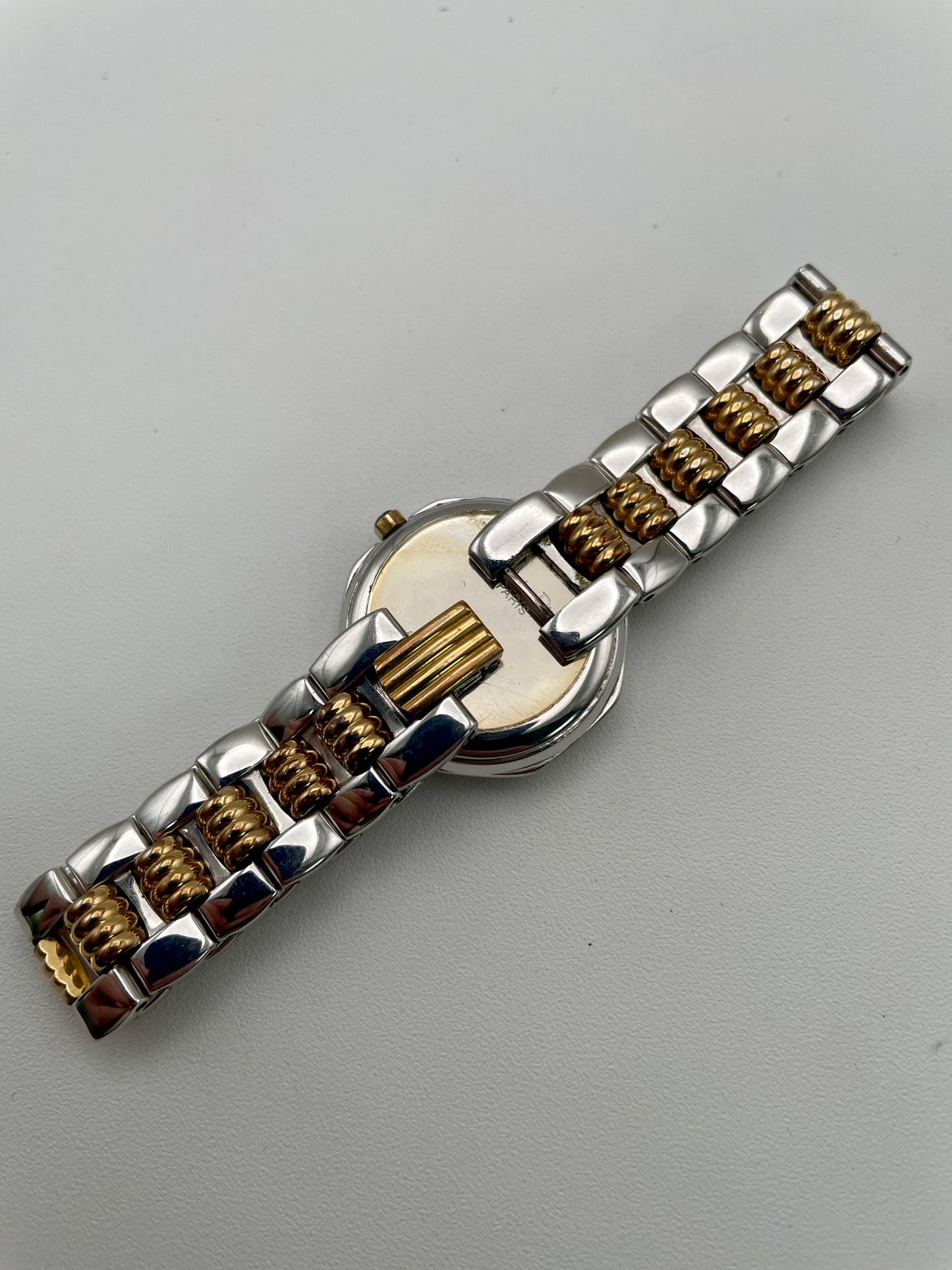 Christian Dior Déposé Octagon vintage watch bracelet, featuring polished stainless steel and gold-tone links.
