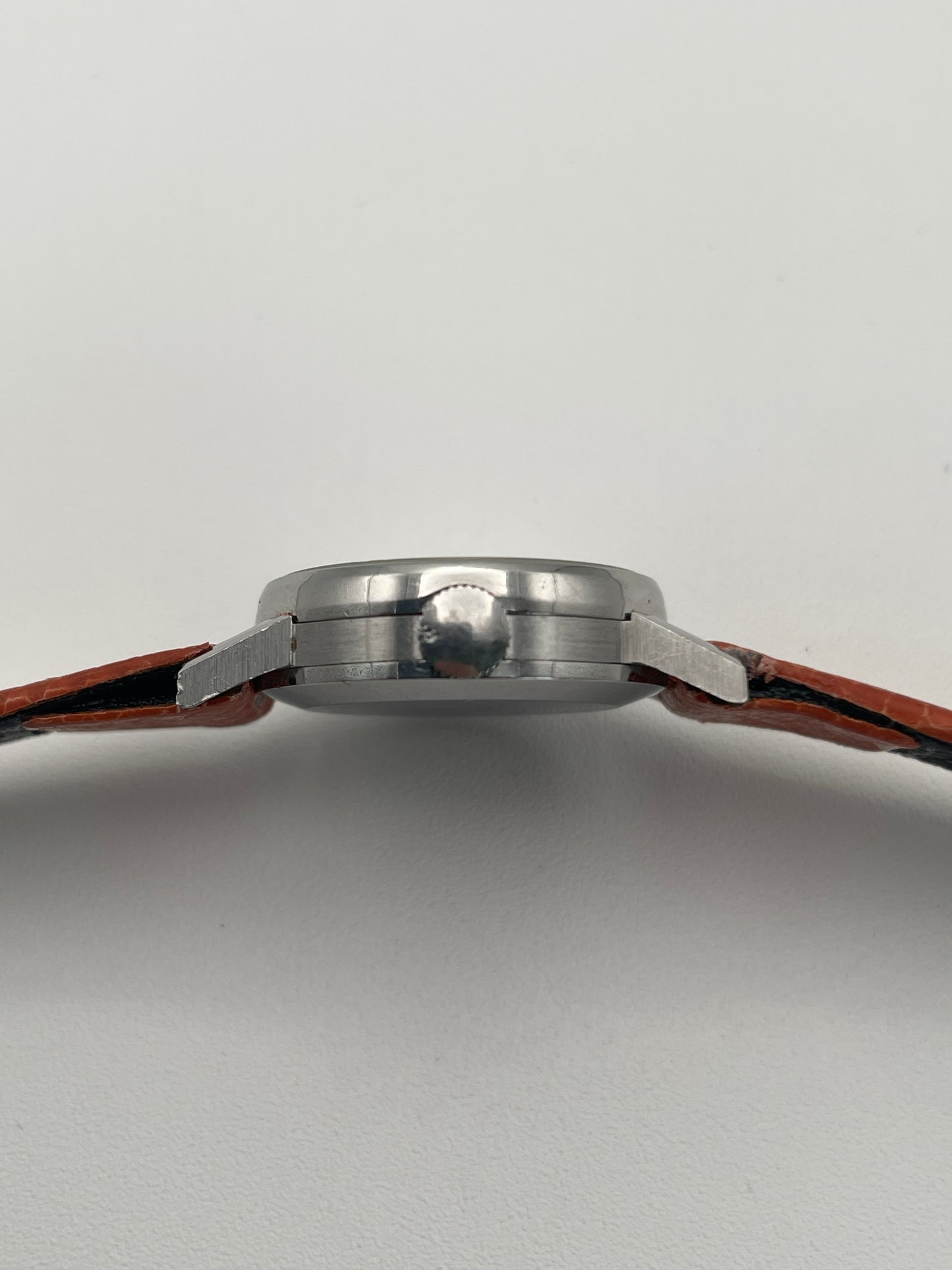 Crown-side view of the Vintage IWC Ladies Caliber 41 watch with a silver dial and stainless steel case.