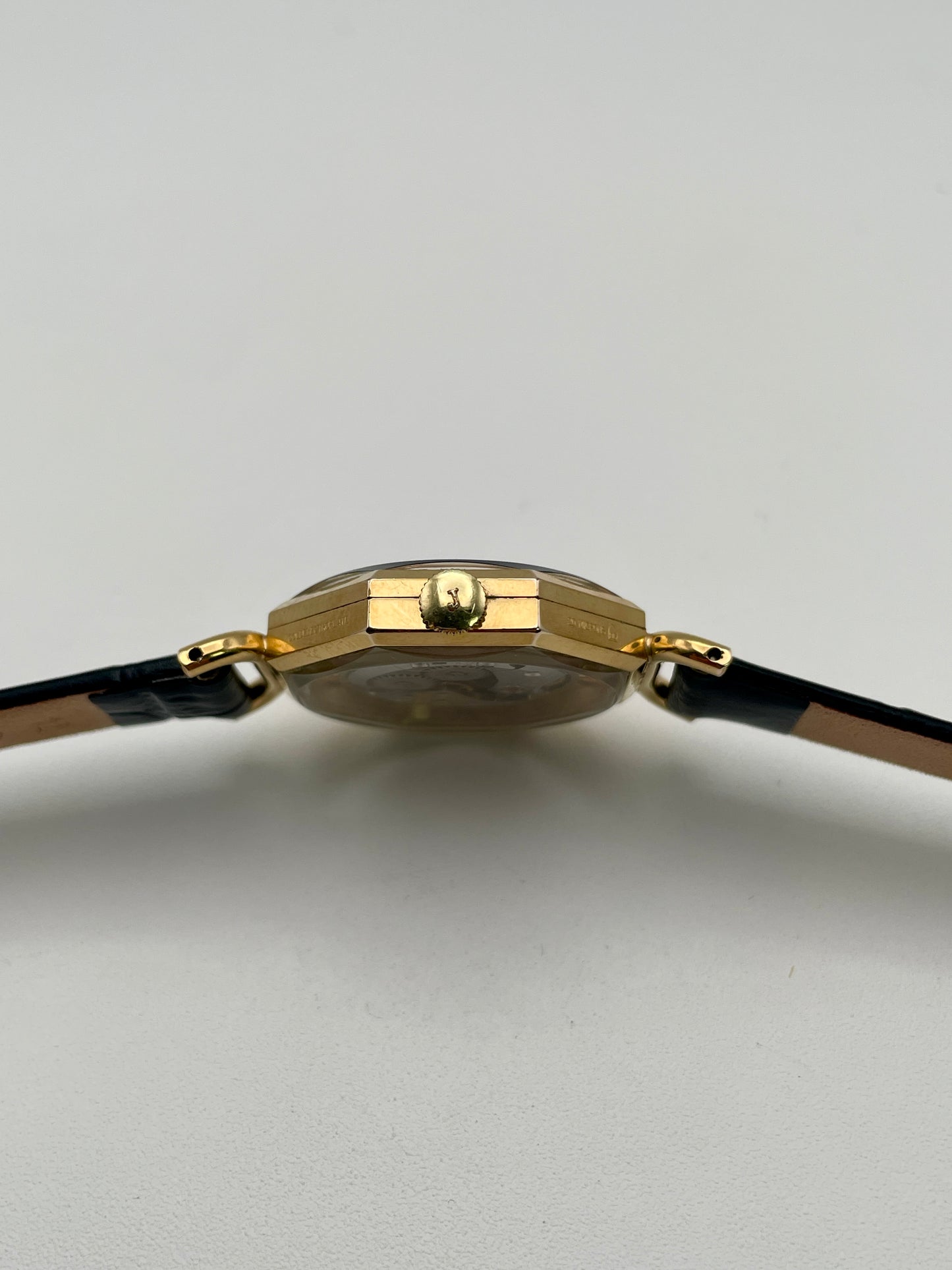 Close-up of the crown and case thickness of the Juvenia Octagion watch