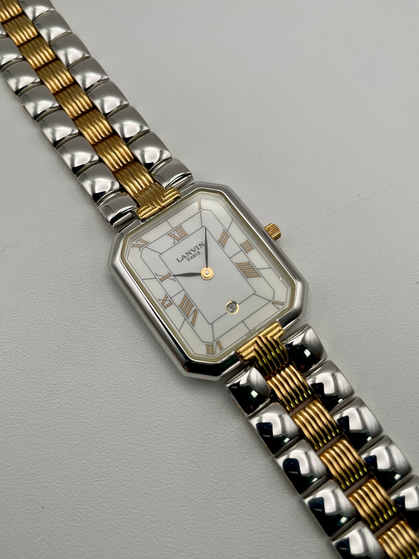 Angled view of Lanvin Paris 516897.B watch showing gold crown and elegant case design