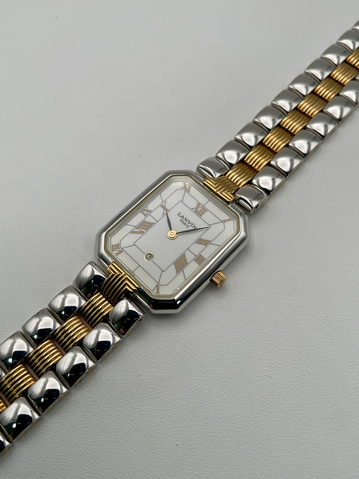 Angled view of Lanvin Paris 516897.B watch showing gold crown and elegant case design