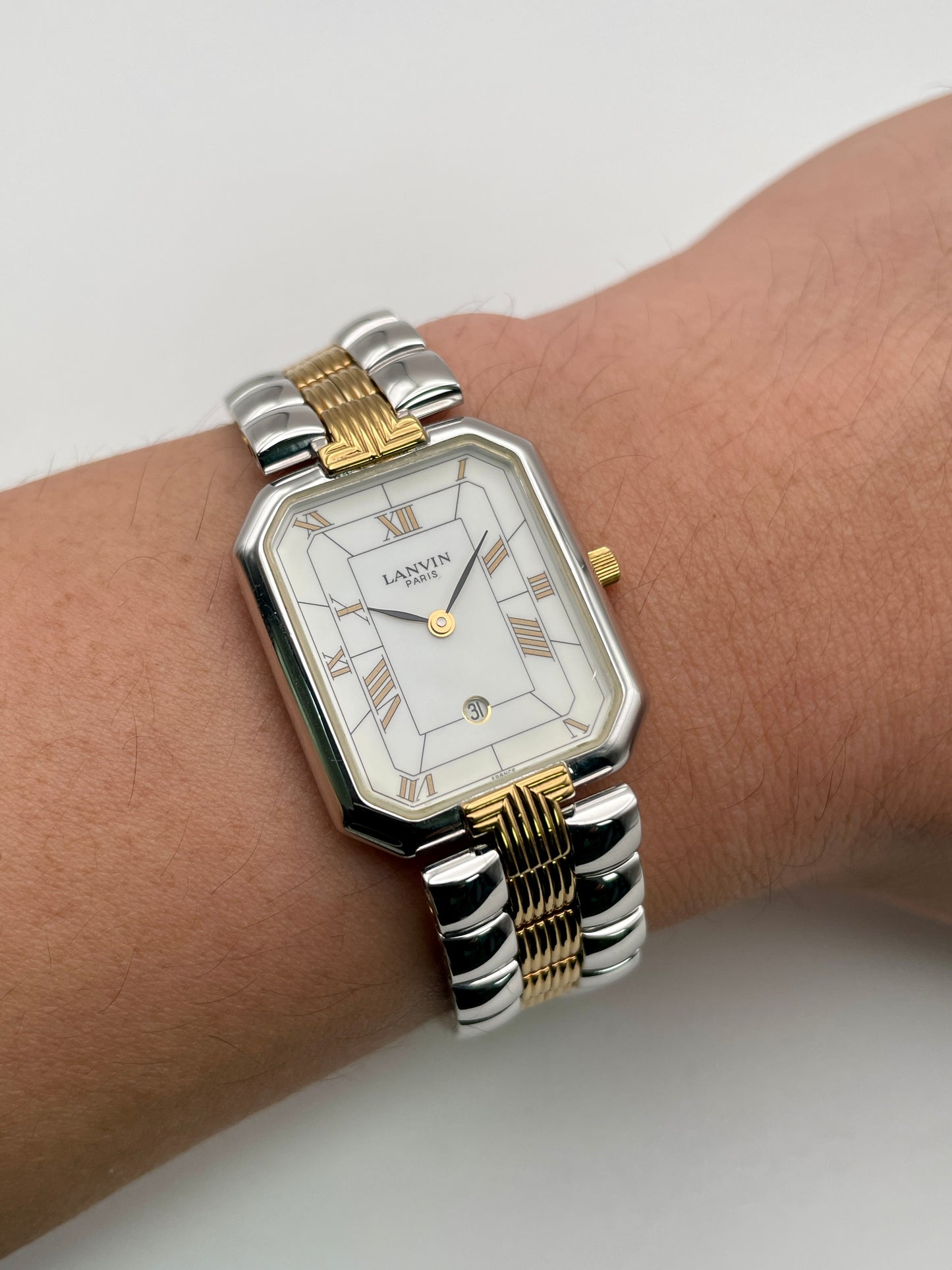 Wrist shot of Lanvin Paris 516897.B showing its elegant fit and two-tone bracelet design