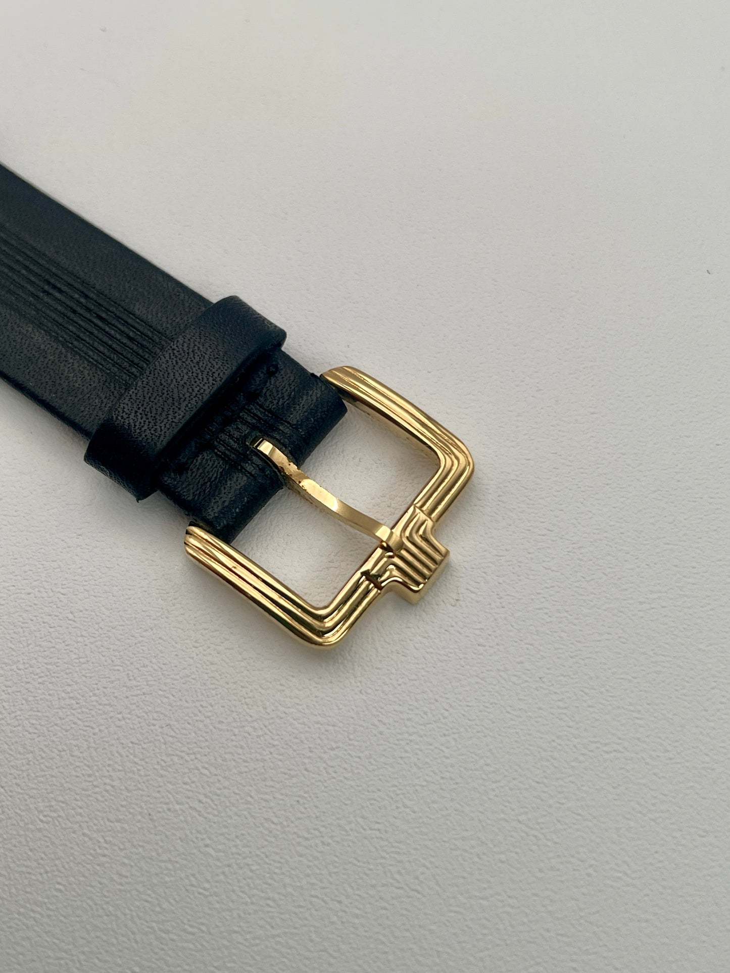 Gold-tone buckle of the Lanvin Paris Vintage Watch, attached to black leather strap