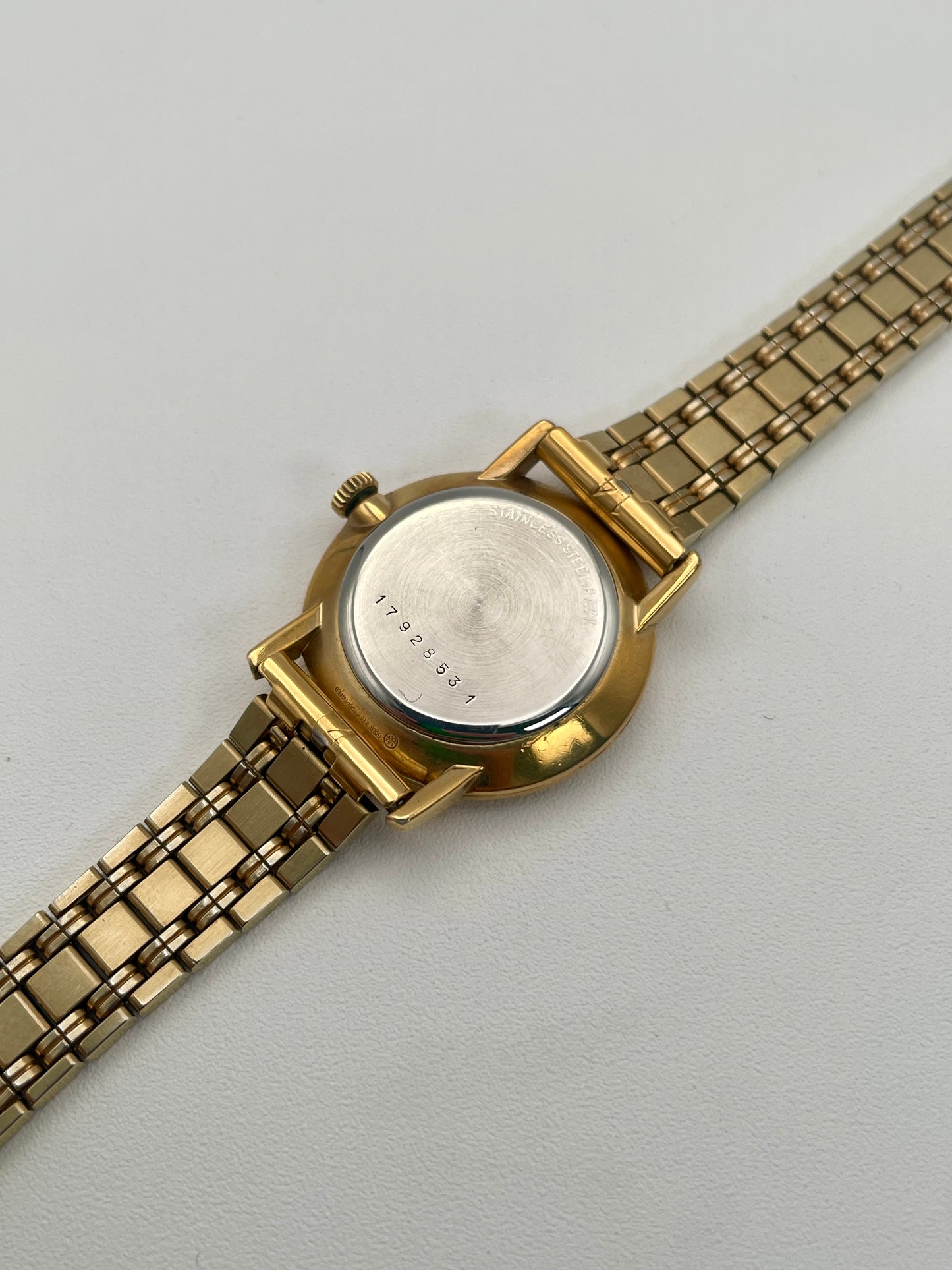 Caseback of the Longines Classic Vintage Ladies Watch in Gold showing the stainless steel back and serial number.