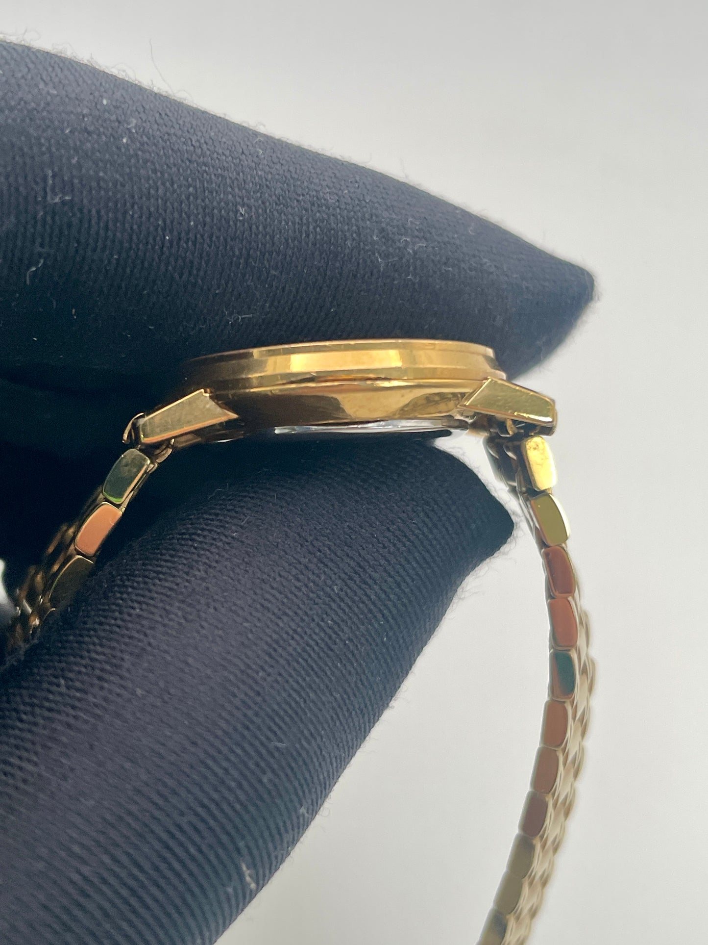 Detailed side view of the Longines Classic Vintage Ladies Watch in Gold, focusing on the gold-tone case.