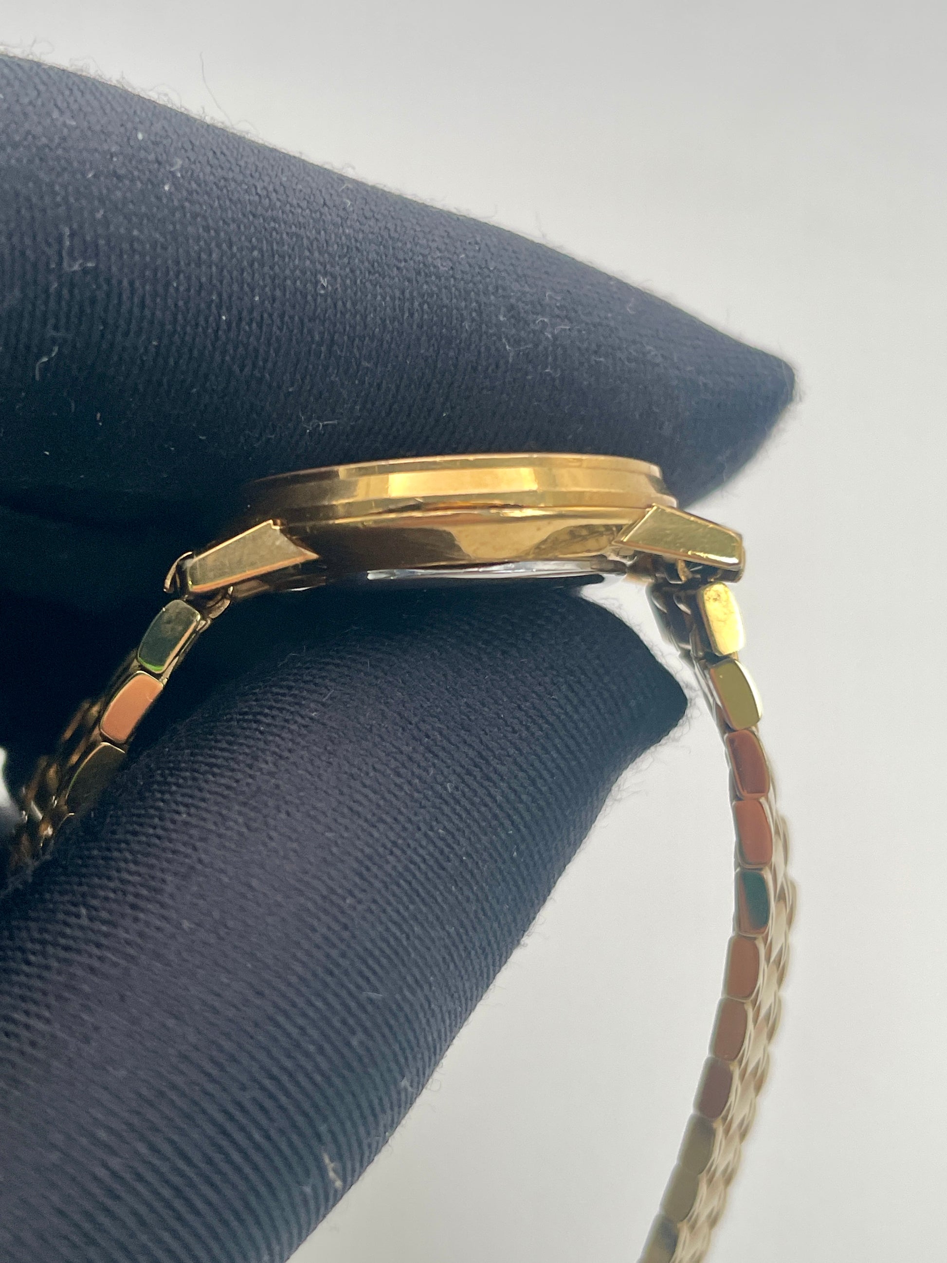 Detailed side view of the Longines Classic Vintage Ladies Watch in Gold, focusing on the gold-tone case.