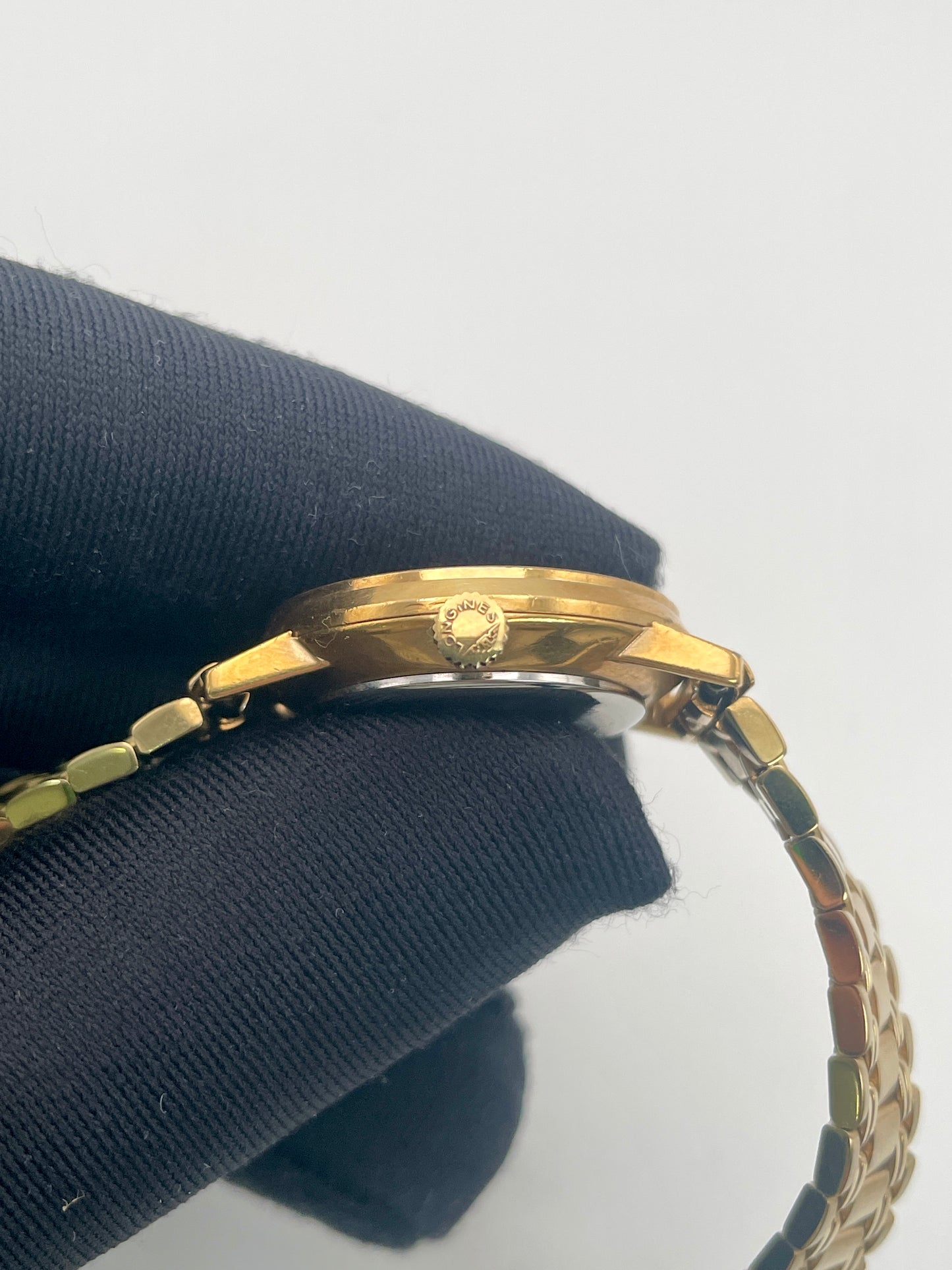 Side view of the Longines Classic Vintage Ladies Watch in Gold, showcasing the crown and slim profile.