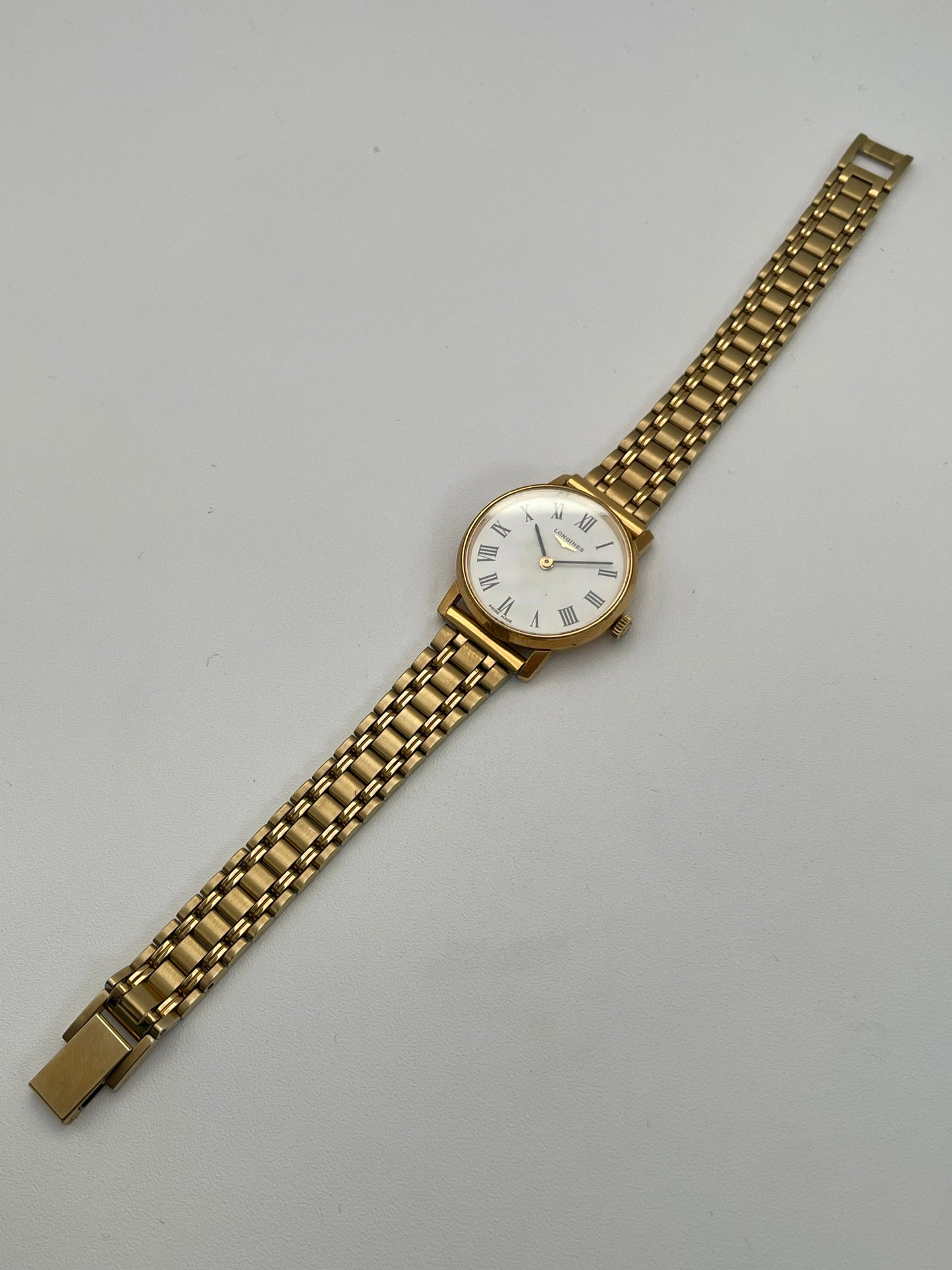 Full view of the Longines Classic Vintage Ladies Watch in Gold with a white dial and gold-tone bracelet.
