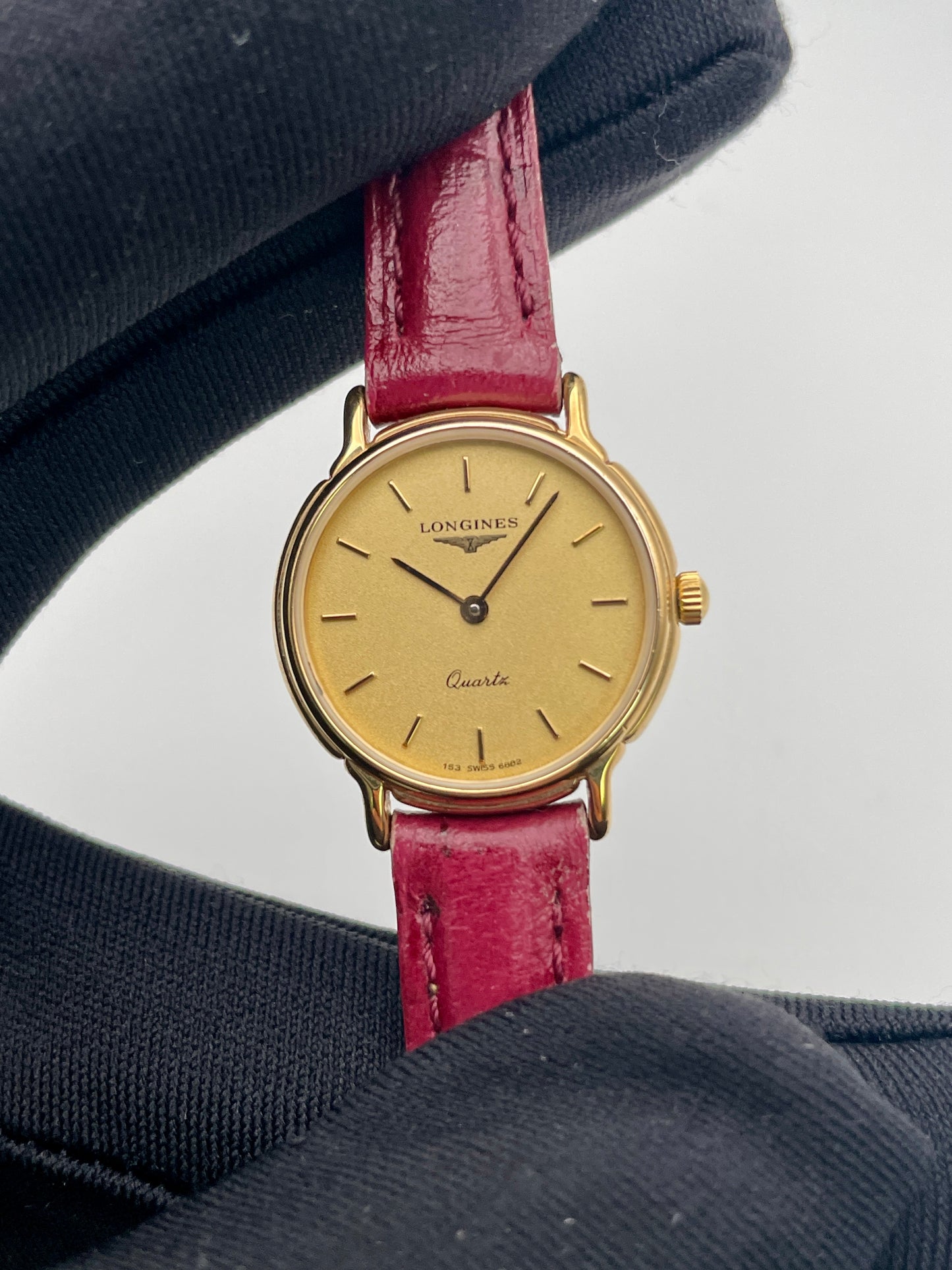 Close-up view of the Longines L153.4 champagne dial with baton hour markers