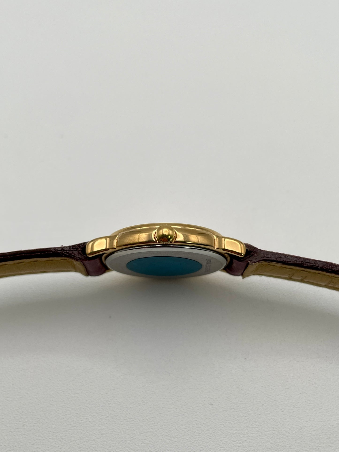 Crown-side view of the Longines vintage gold-tone quartz watch