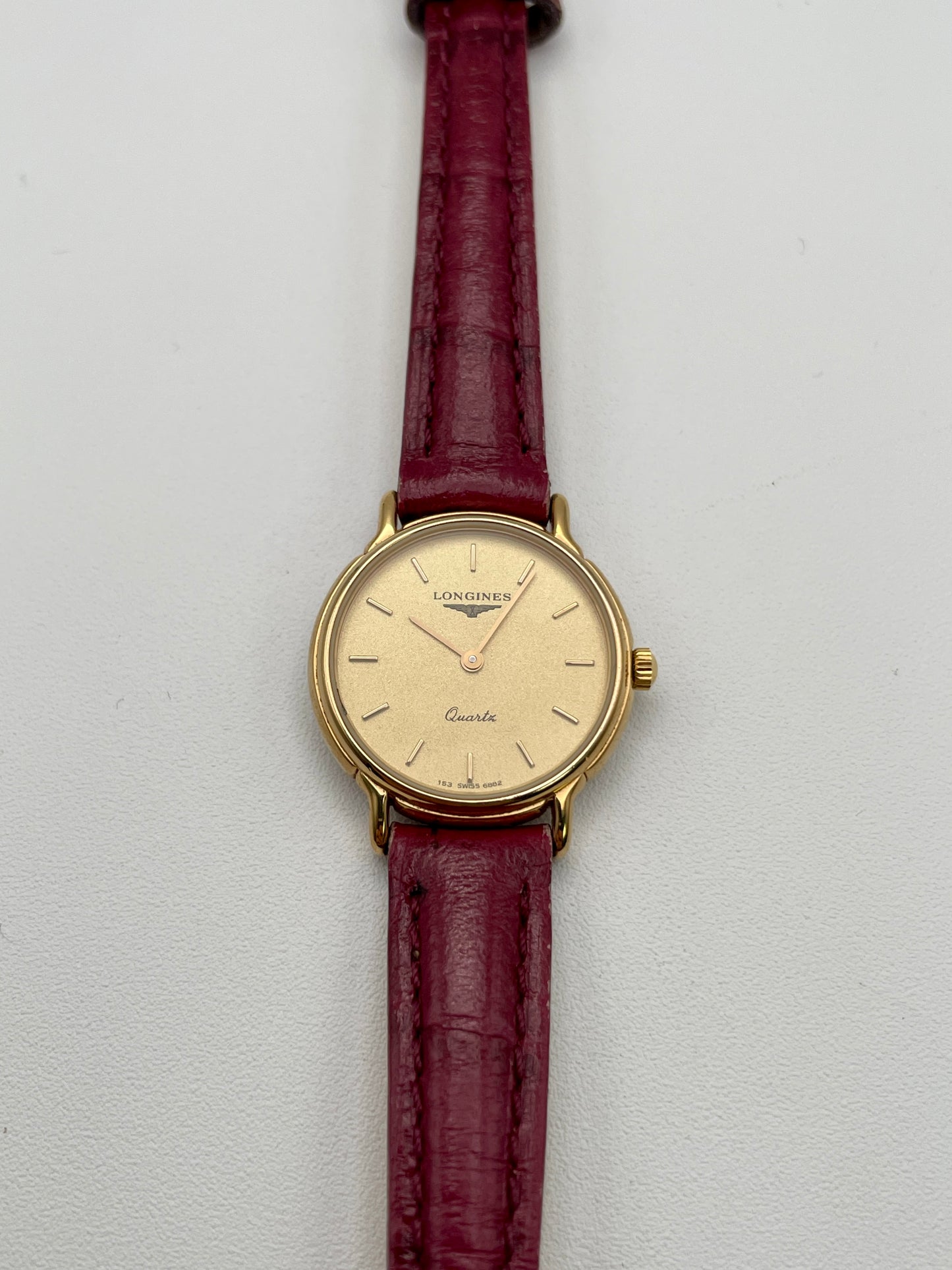 Front view of Longines L153.4 Vintage Women's Watch in gold case with red leather strap