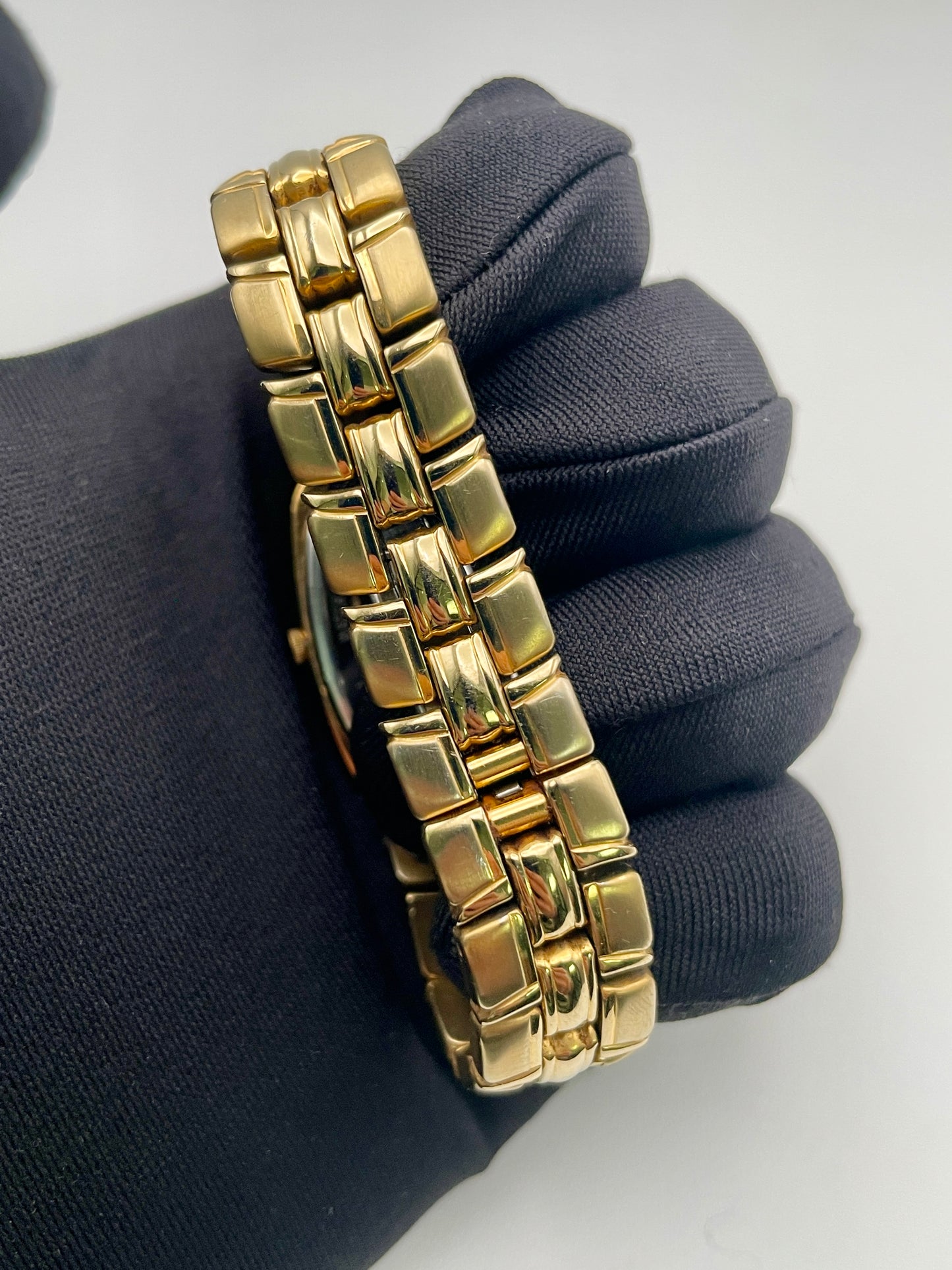 Close-up of the gold-tone bracelet of the Orient Oval Vintage Women's Watch, showing the polished interlink design.