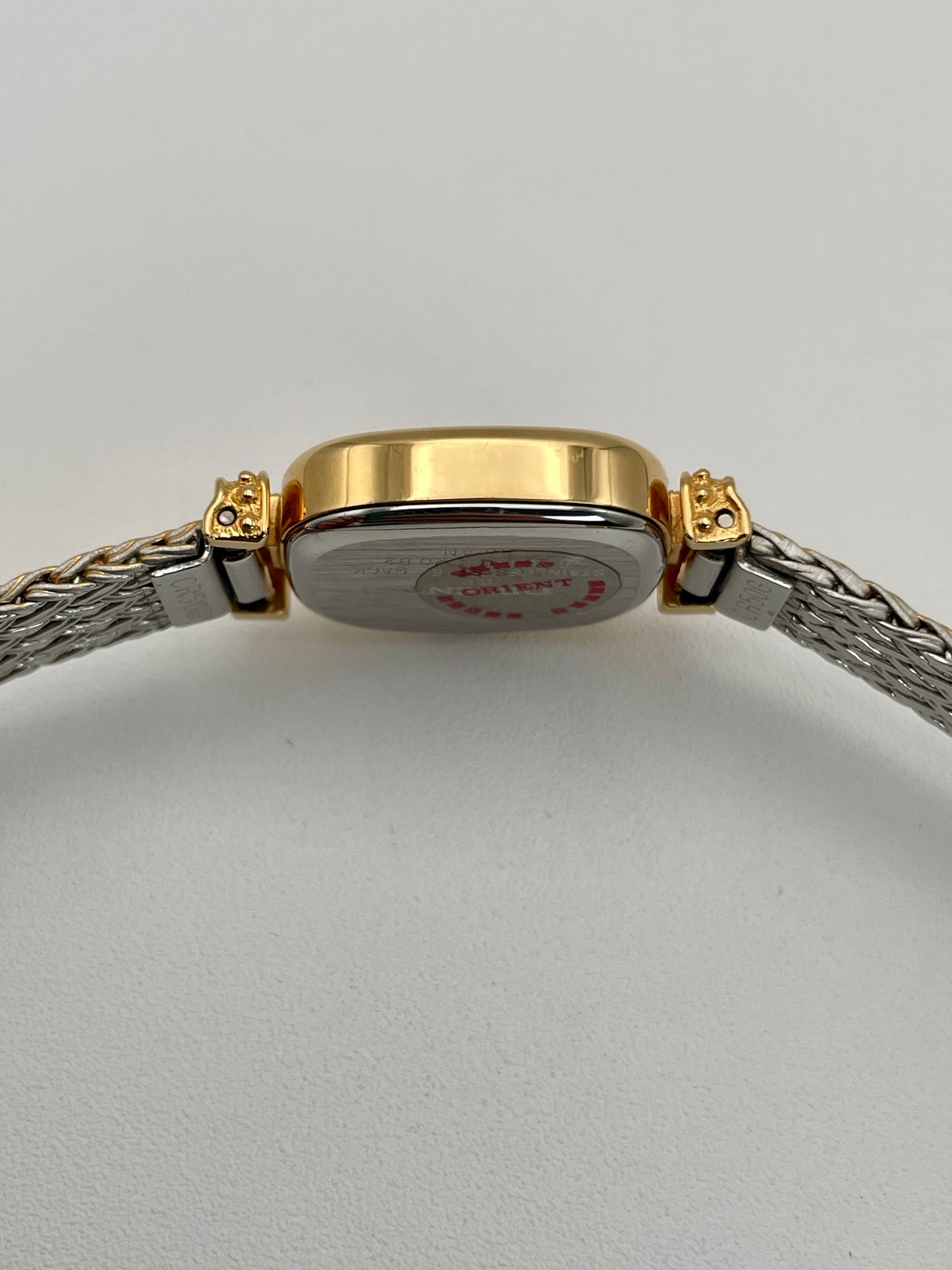 Side view of Orient Vintage Women's Watch displaying the thickness of the gold case and polished bracelet.