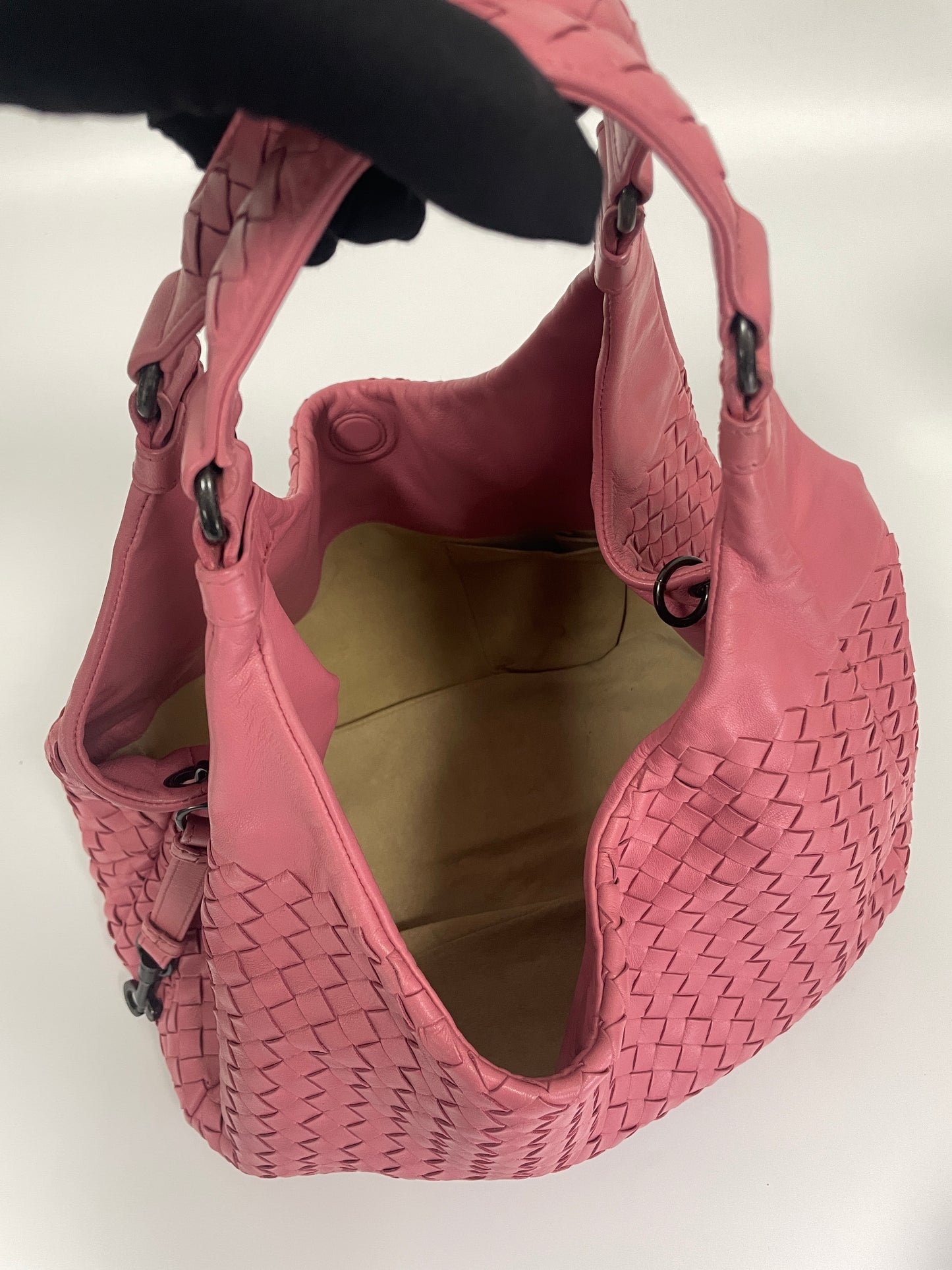 Overhead view of the Bottega Veneta Intrecciato Campana Shoulder Bag in pink leather, displaying the open interior and spacious design.