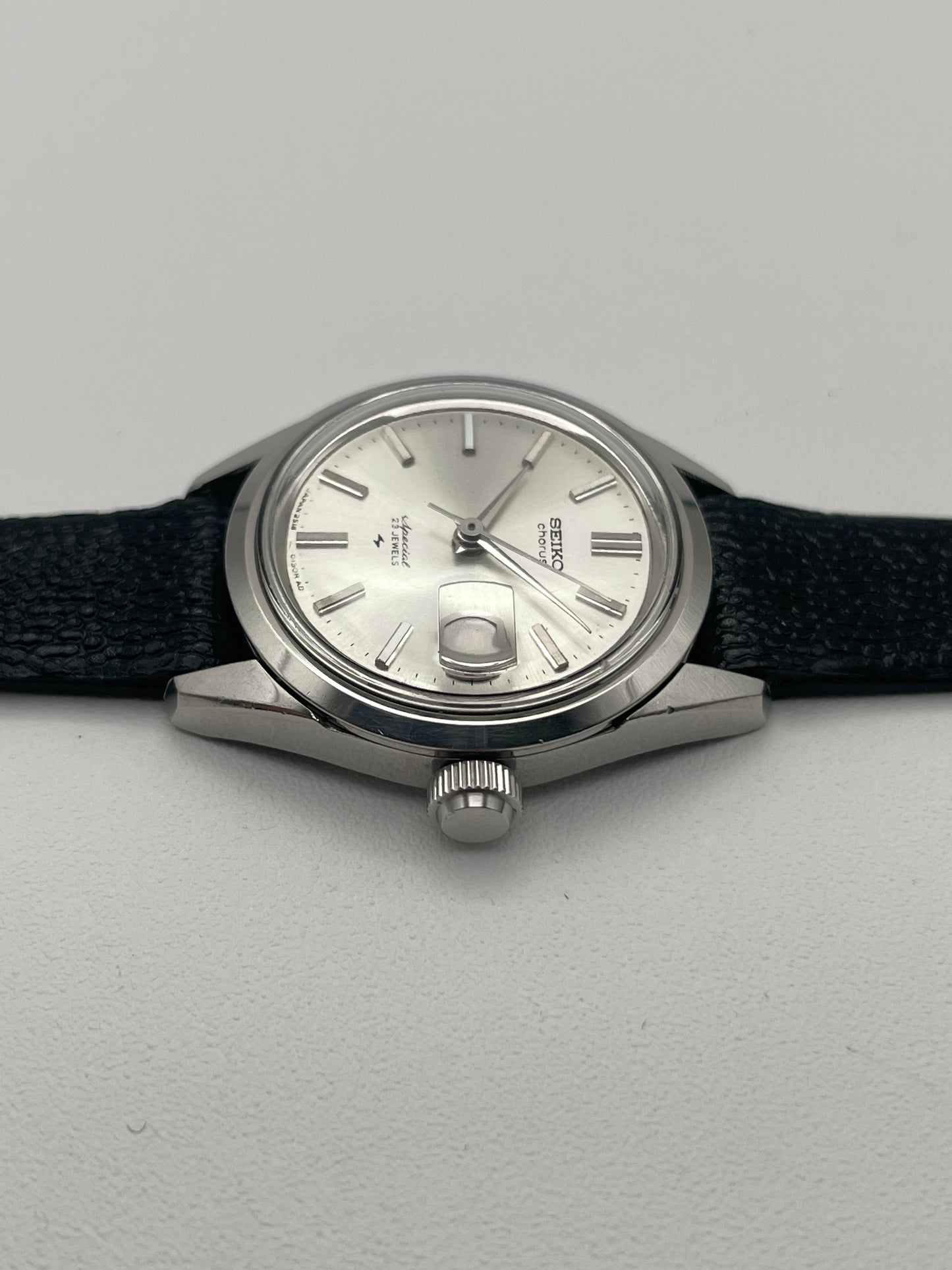 Flat front view of Seiko Chorus vintage watch, highlighting the crown and silver dial.
