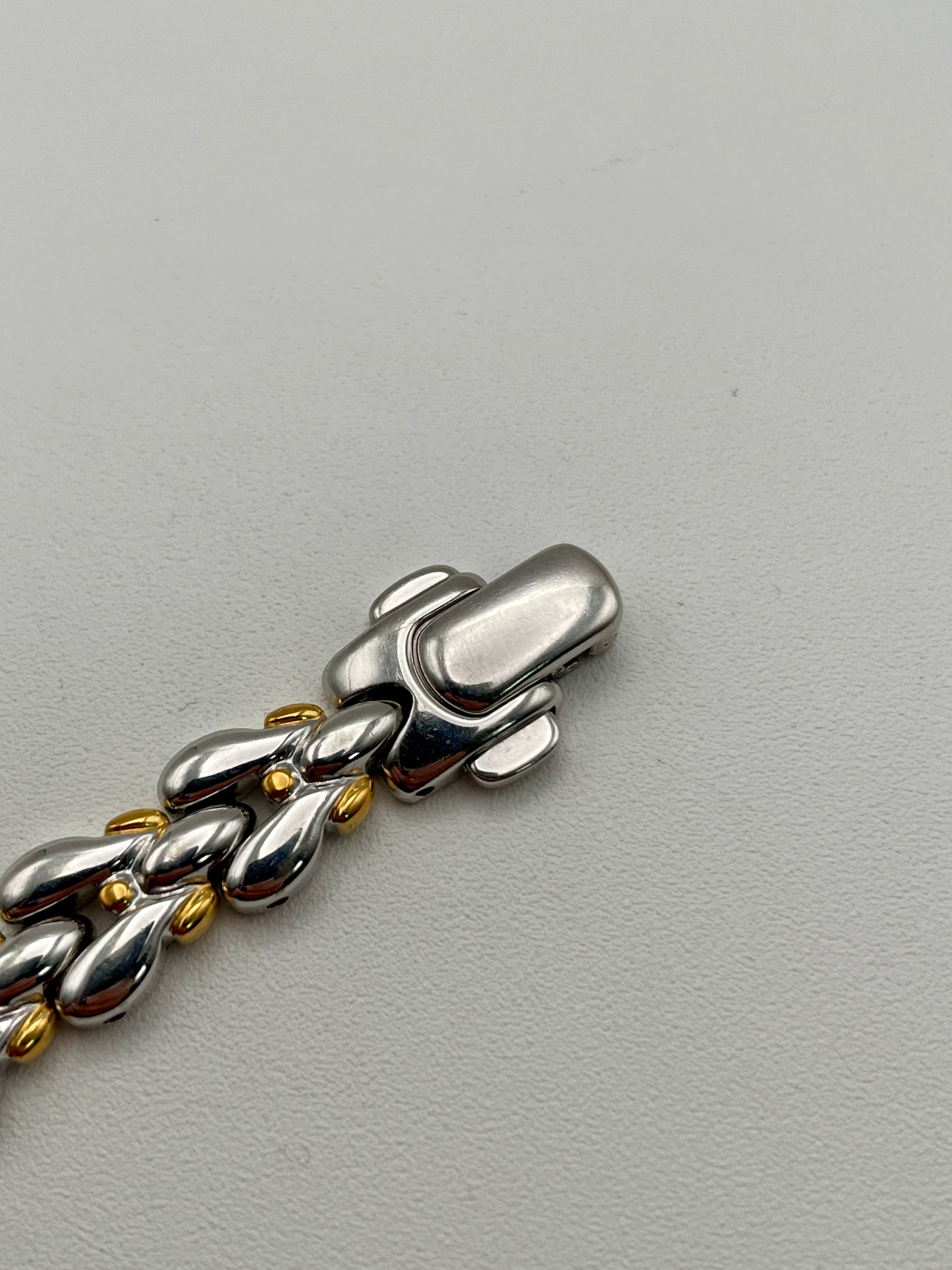 Close-up of the polished clasp with two-tone finish