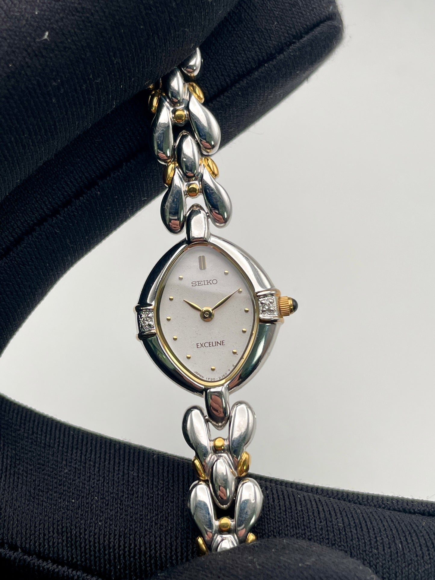 Close-up view of the dial and diamonds, emphasizing the teardrop silhouette