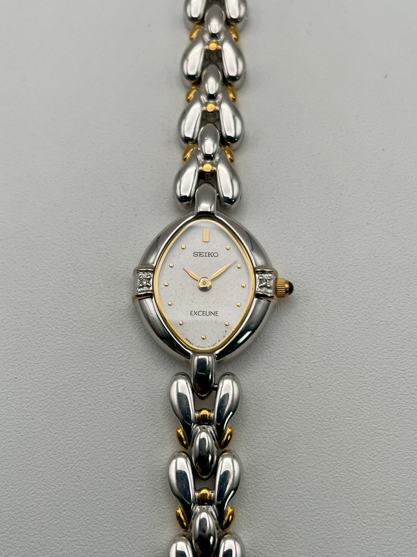 Seiko Exceline 1F20-6B60 vintage women's watch with teardrop case and two-tone bracelet, front view