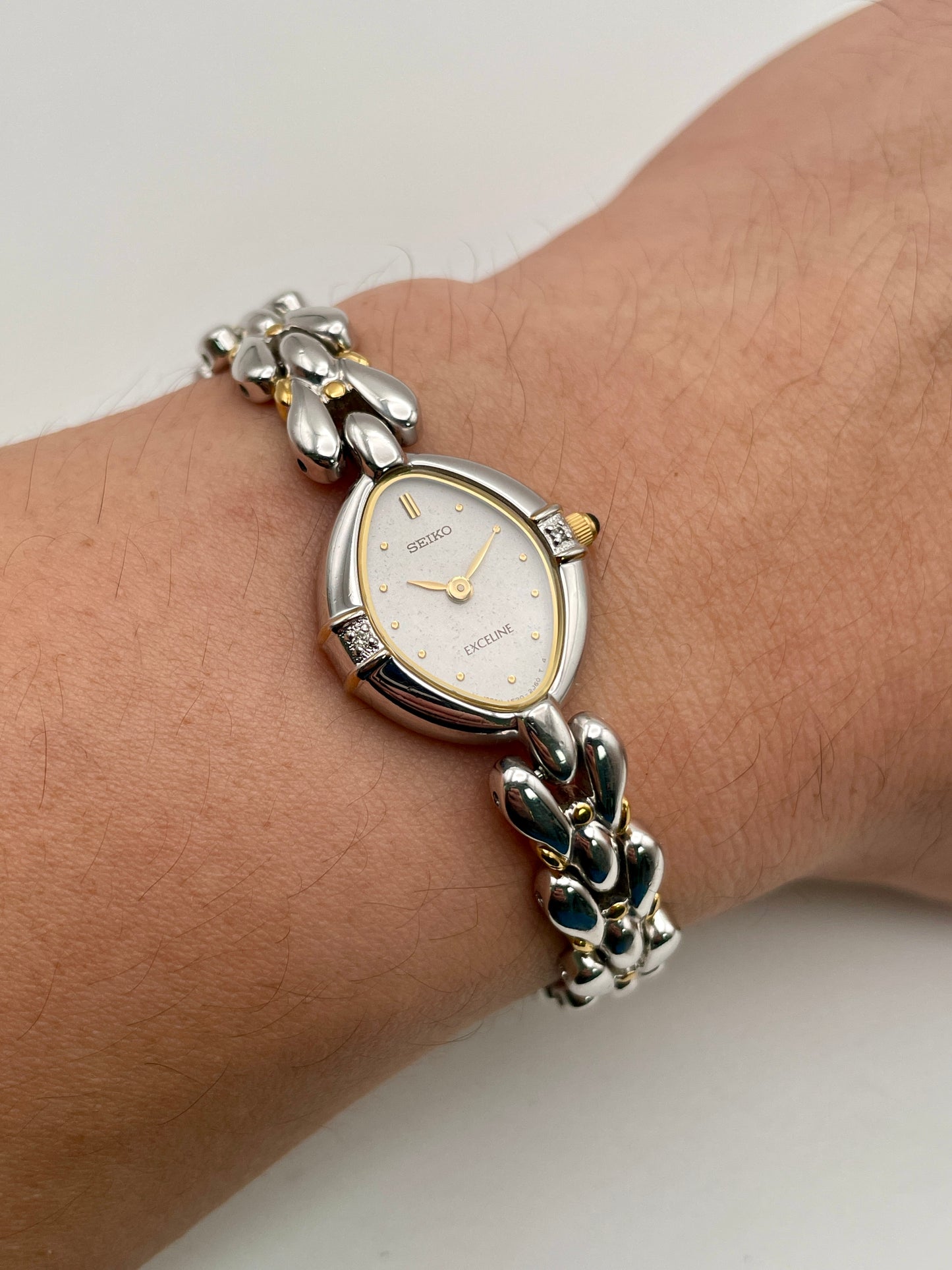 Wrist shot showing the Seiko Exceline watch worn, highlighting its slim profile and elegant bracelet