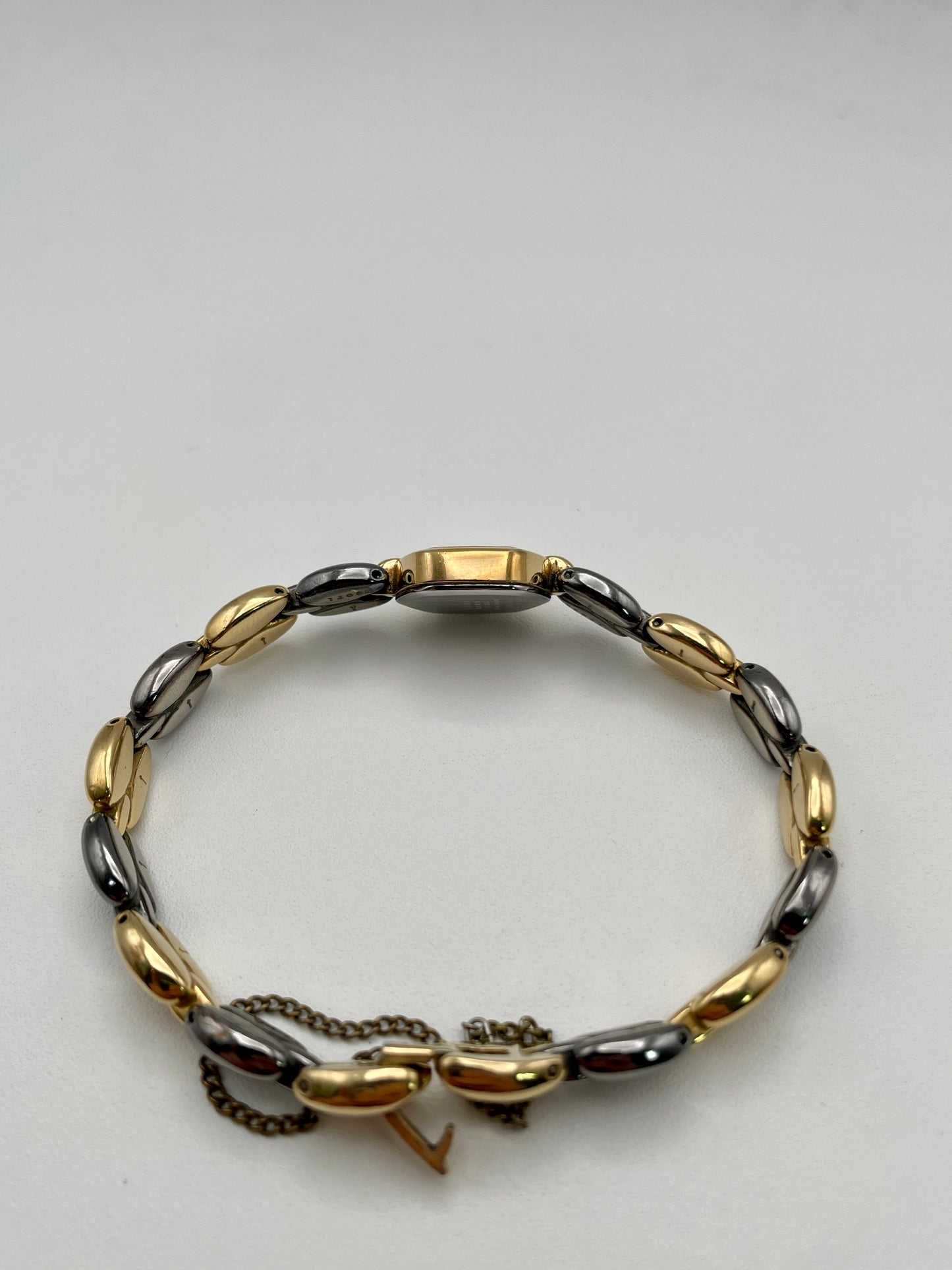 Side case view of Seiko Hexagon watch highlighting gold-tone case and bracelet profile