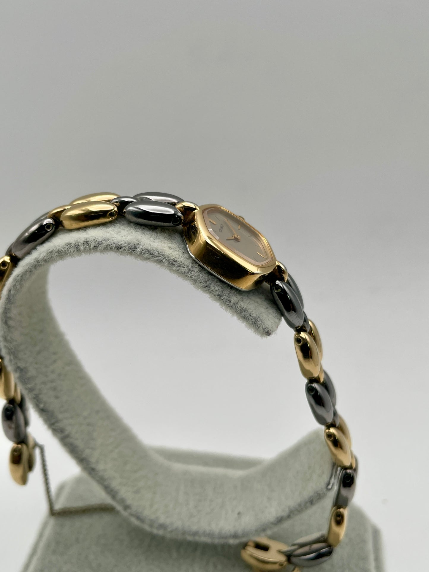 Side case view of Seiko Hexagon watch highlighting gold-tone case and bracelet profile