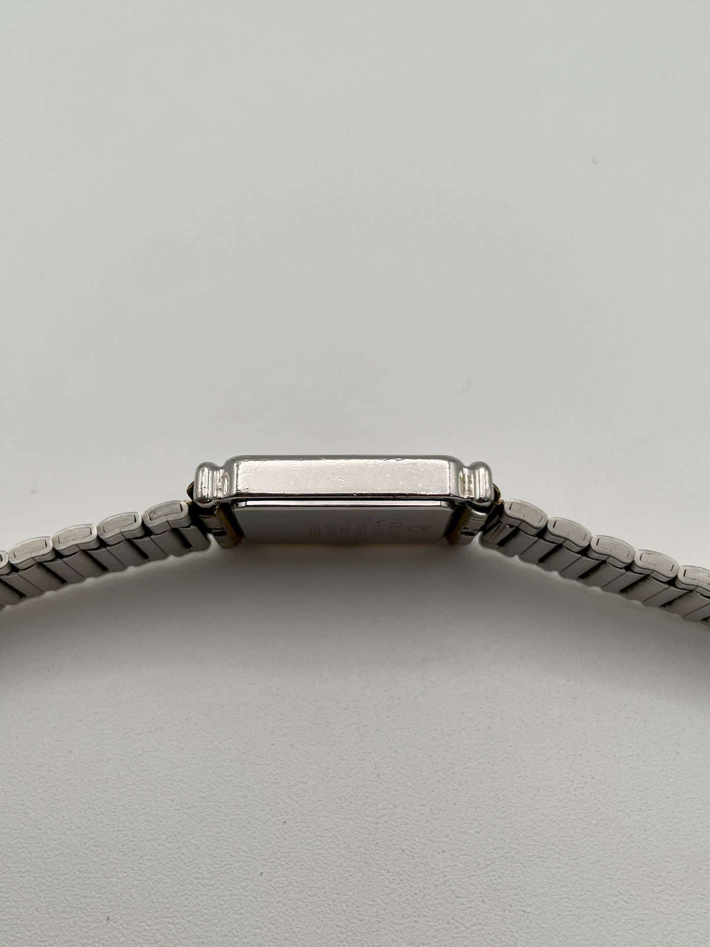 Side profile view showing the smooth curvature of the watch case