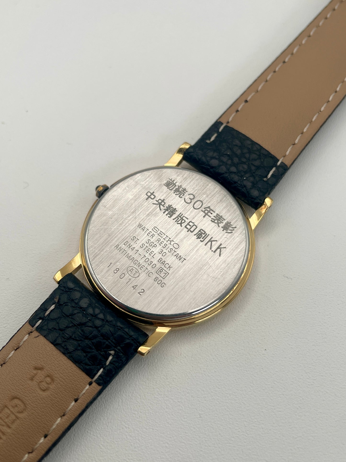 Caseback of Seiko Dolce 8N41-7030 Vintage Watch featuring stainless steel back and model details.