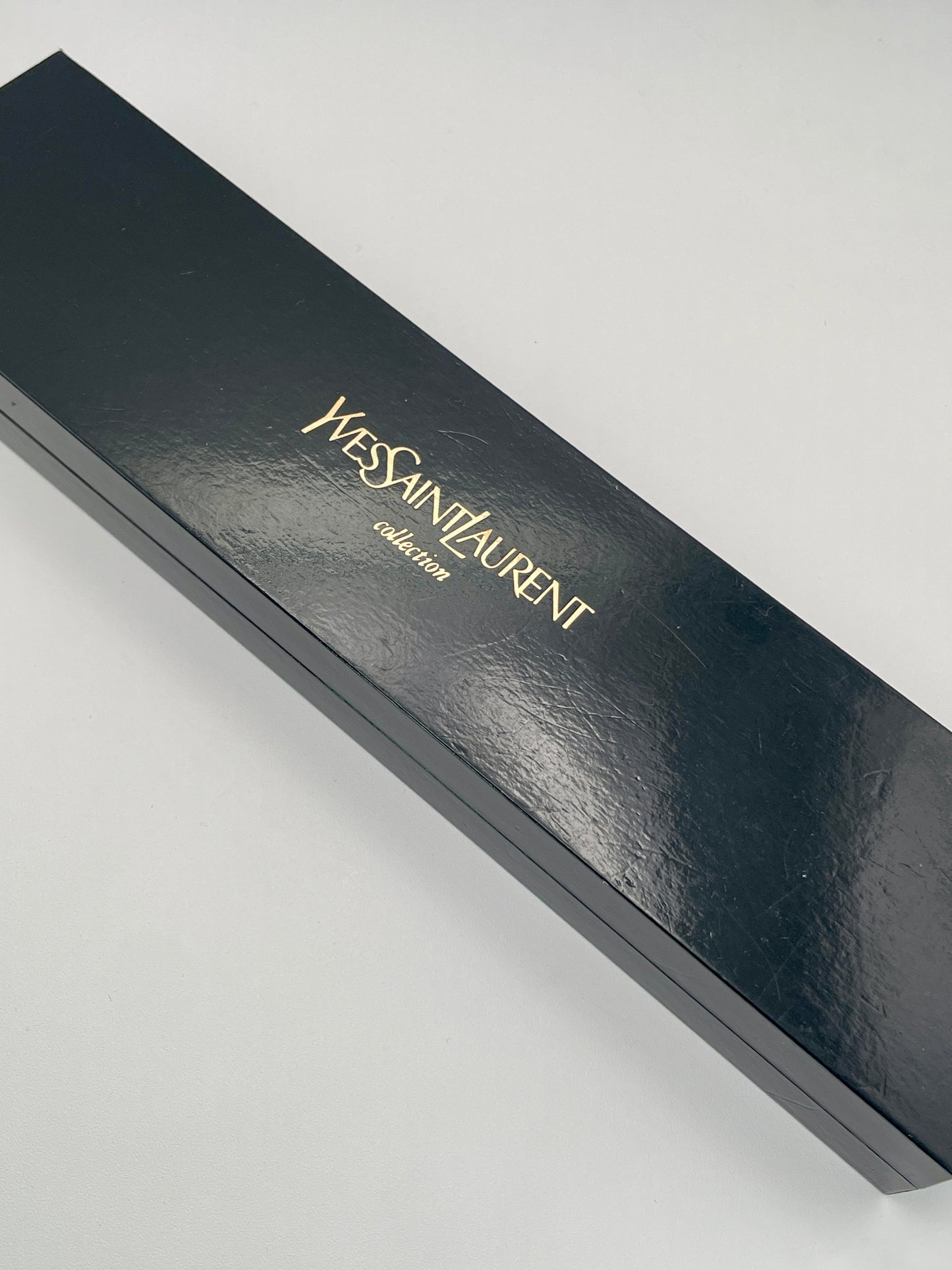 Yves Saint Laurent Black Pour Femme vintage women's watch in a box.