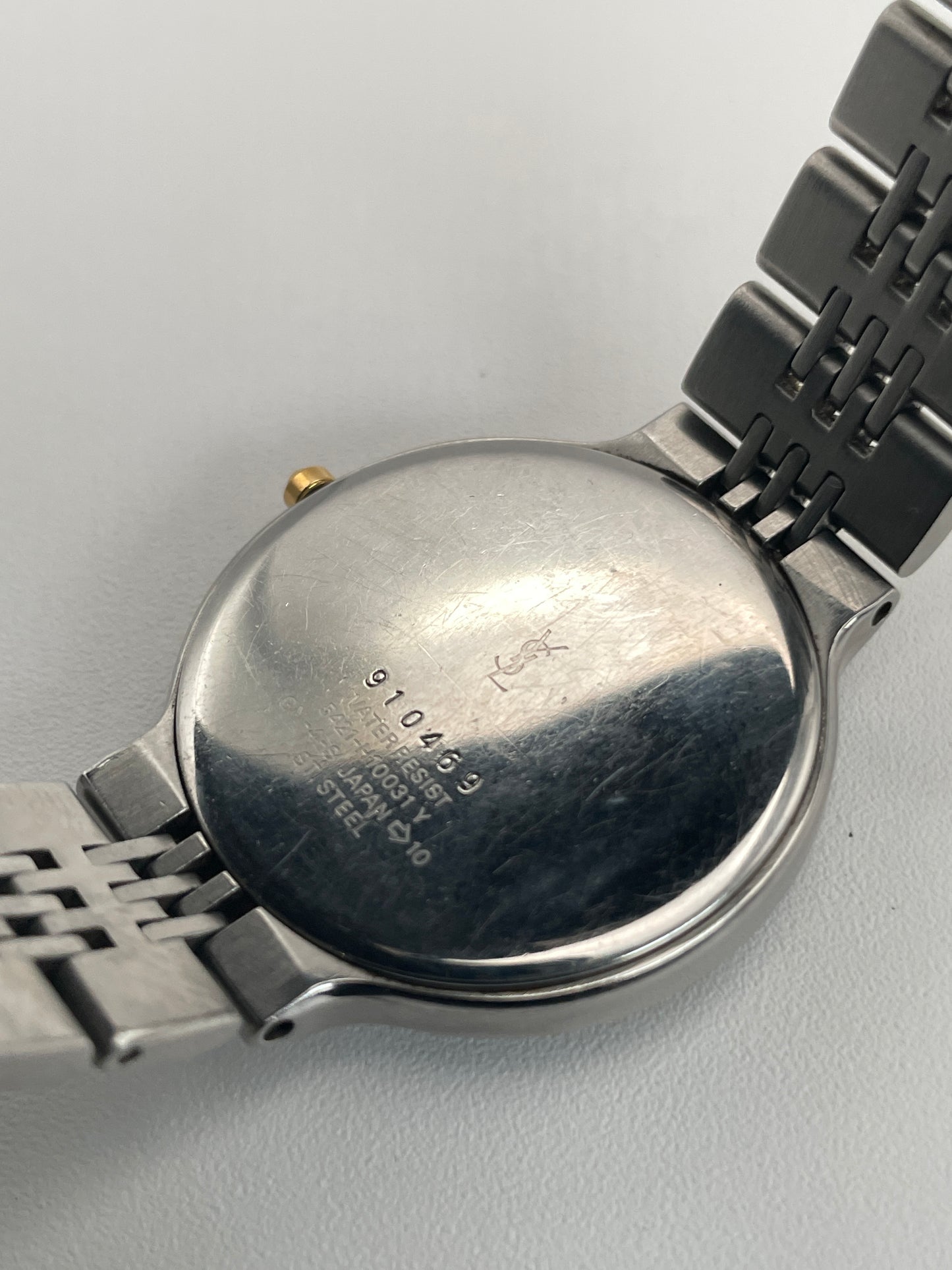 Back view of the YSL La Collection vintage women's watch showcasing its engraved case back and bracelet design.