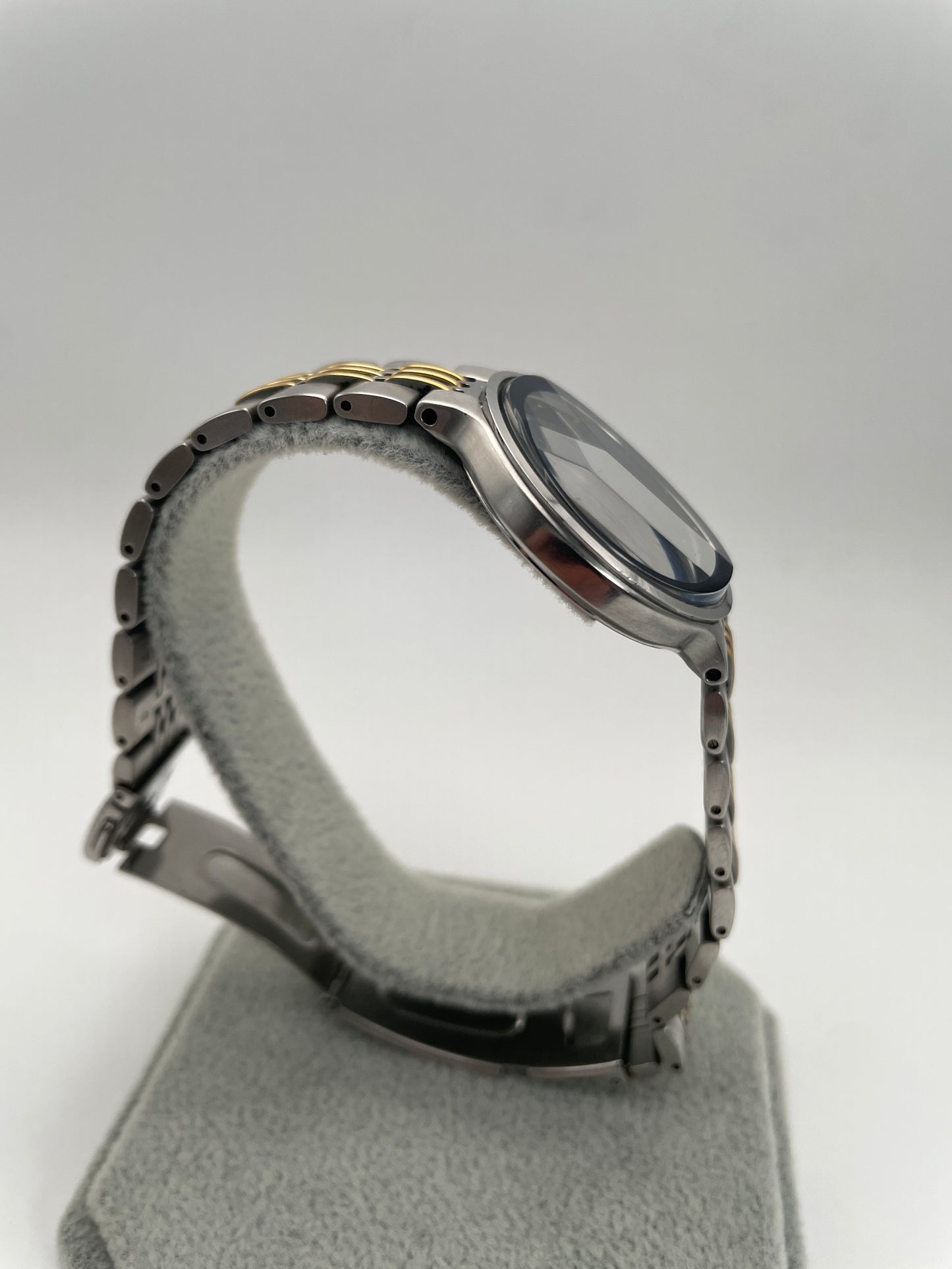 Side profile of the YSL La Collection vintage women's watch, highlighting its slim design and two-tone stainless steel bracelet.