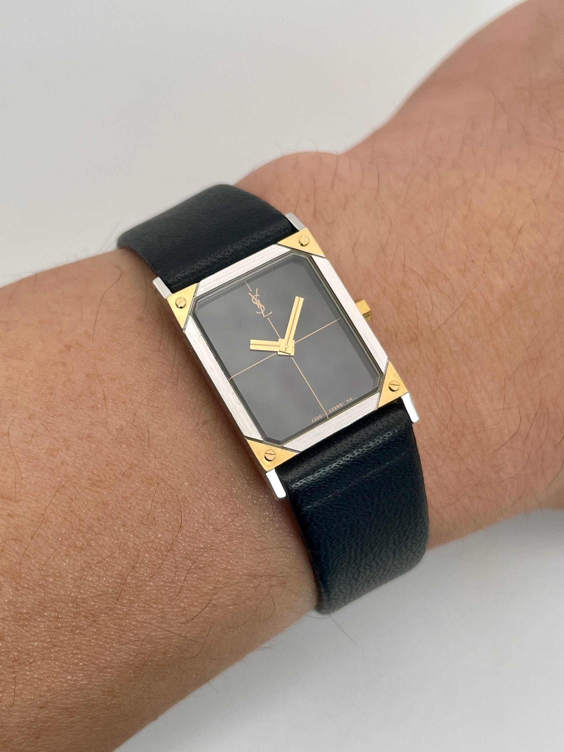 Yves Saint Laurent vintage women's watch worn on the wrist, showcasing its sleek design.