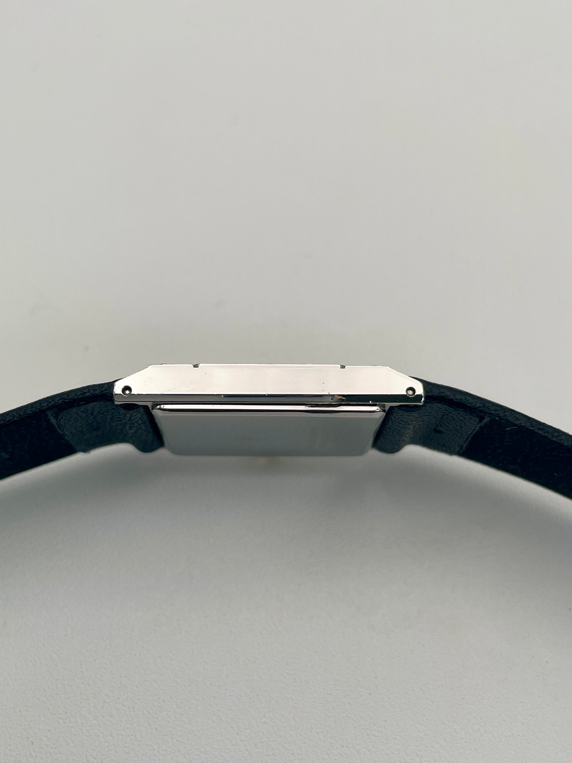 Side view of Yves Saint Laurent vintage women's watch highlighting the thin rectangular case.