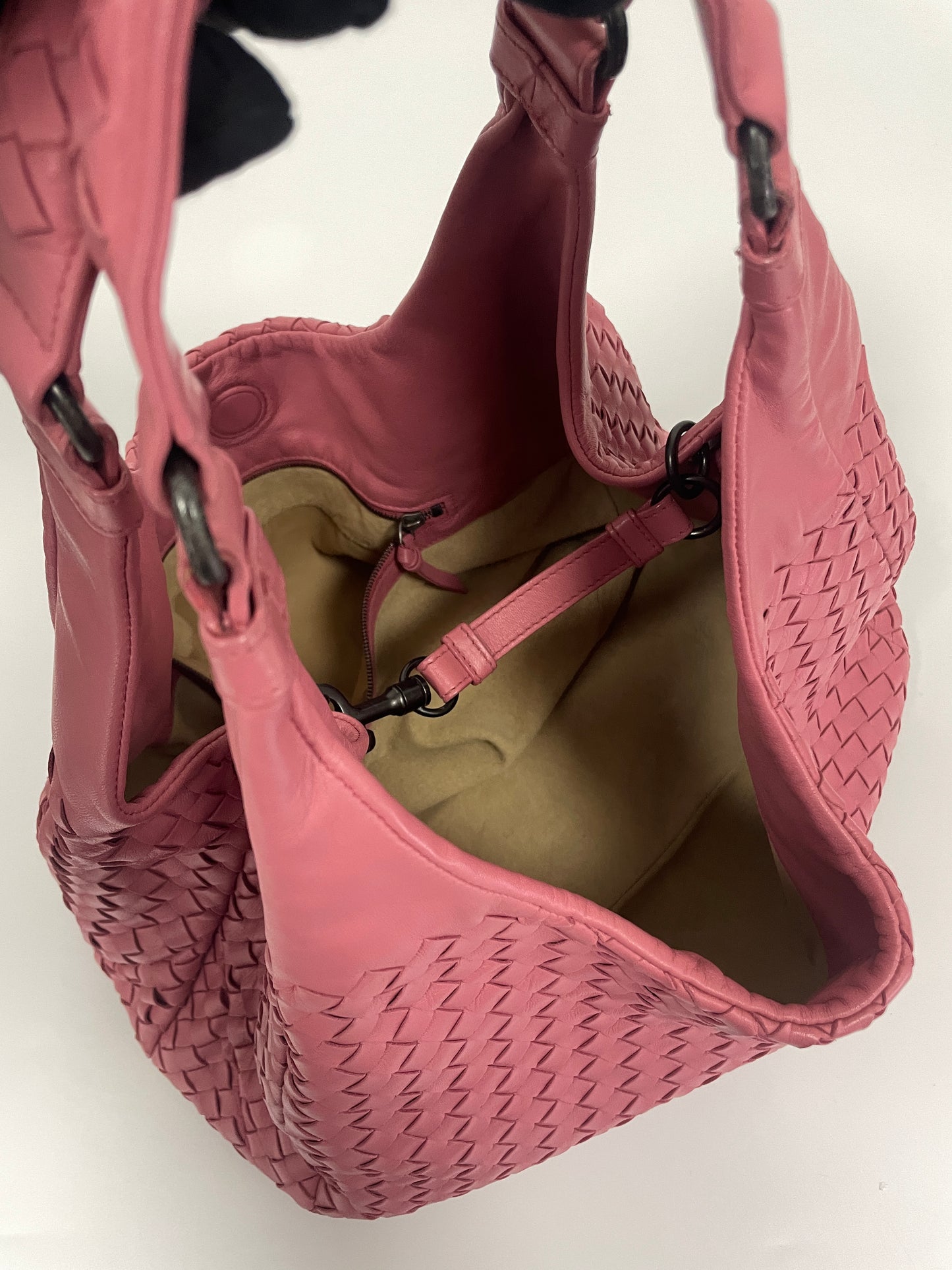 Overhead view of the Bottega Veneta Intrecciato Campana Shoulder Bag in pink leather, displaying the open interior and spacious design.