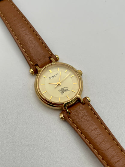 Main view of Burberry 3200 vintage women’s watch in gold with light brown leather strap

